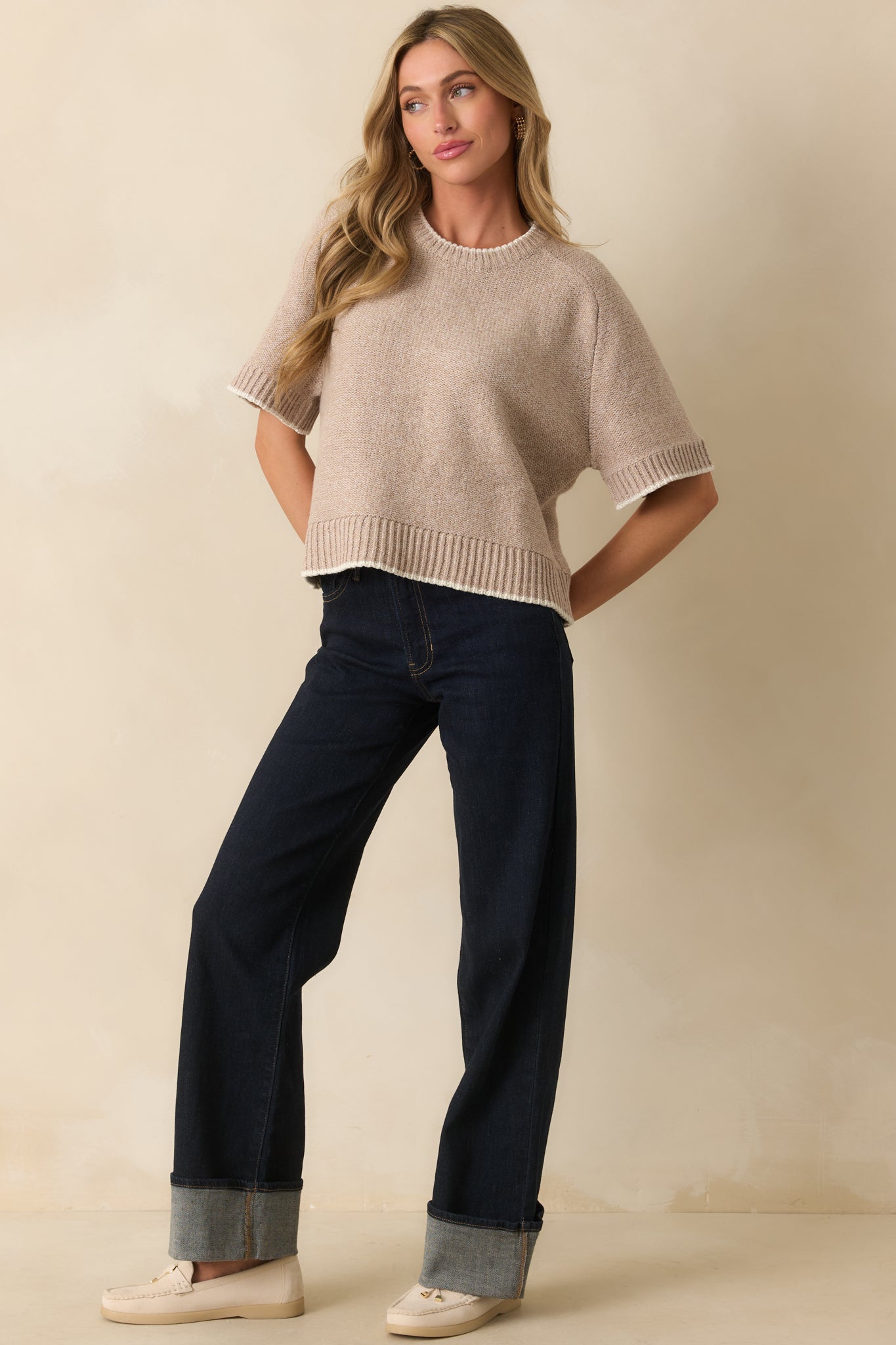 Oatmeal beige knit sweater with ribbed hems and relaxed oversized fit, front view.