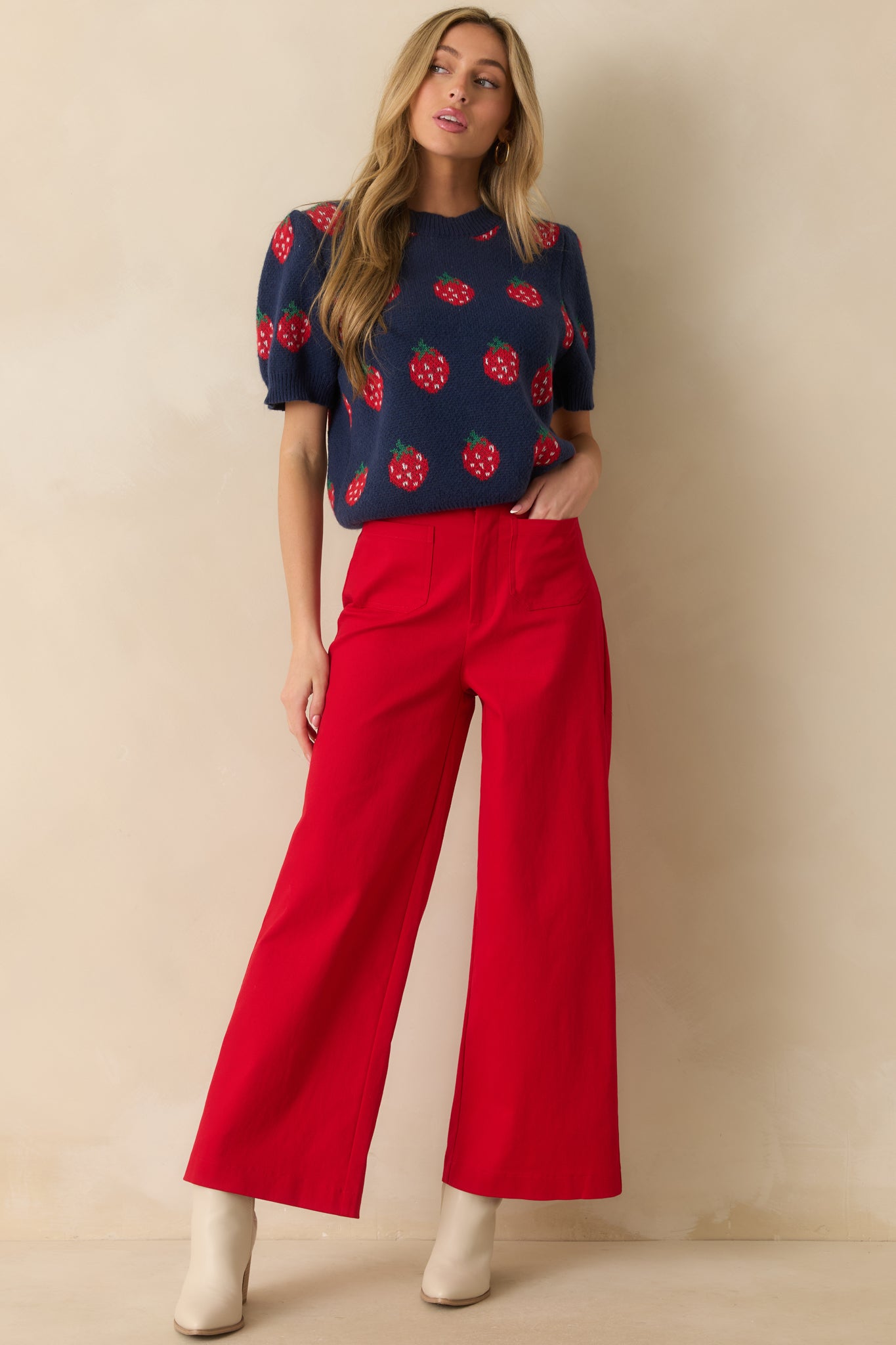 Structured red jeans with high waist, front pockets, and flattering wide-leg design.