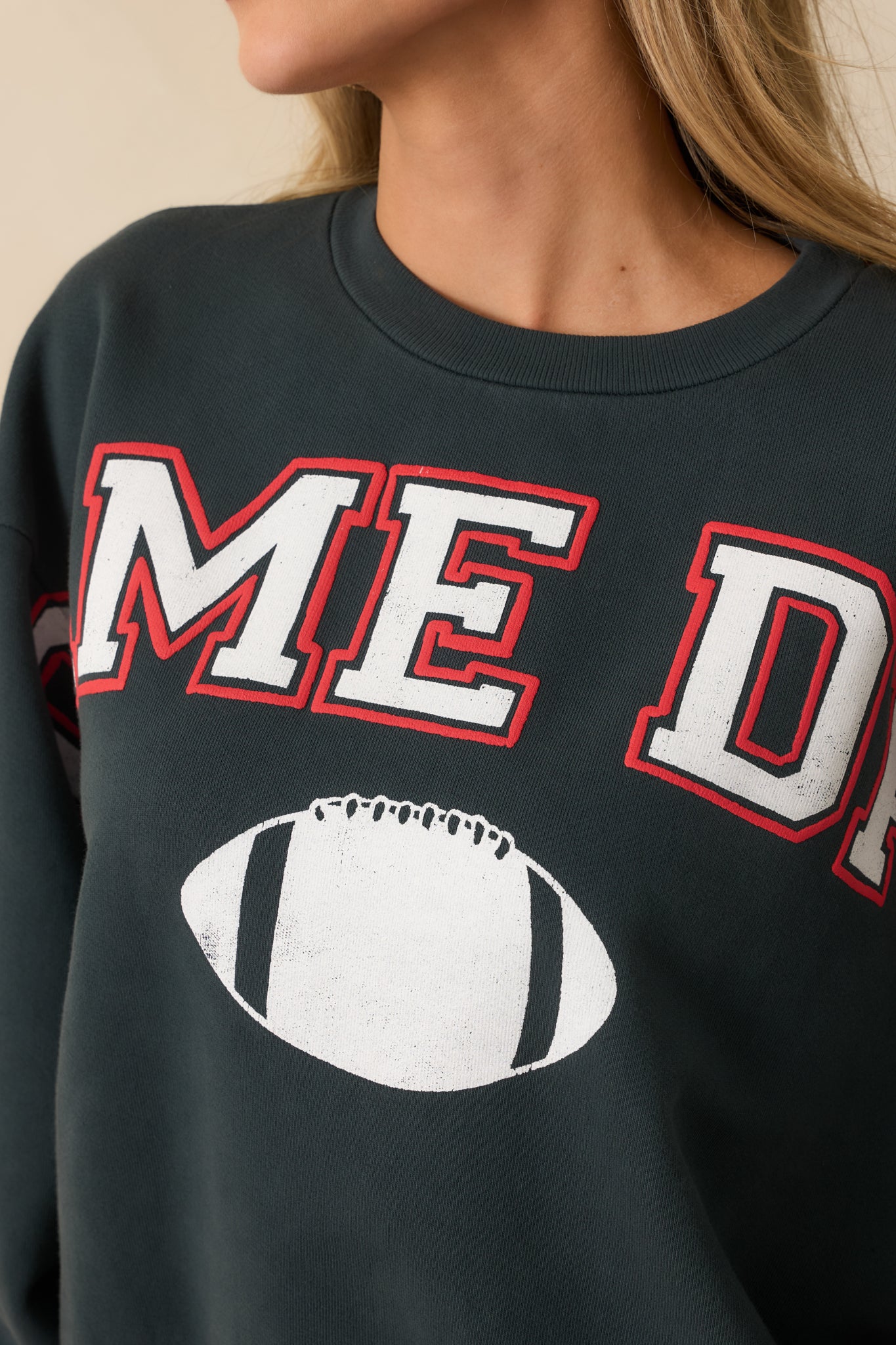 Detailed look at the white and red “GAME DAY” graphic and smooth cotton fabric surface.