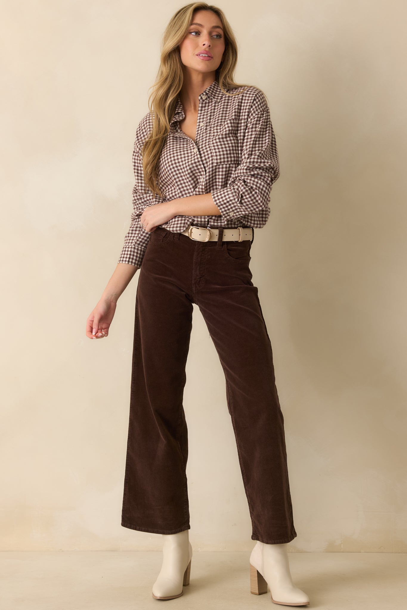 Full body front angle highlighting the long sleeves and functional button-up front closure.