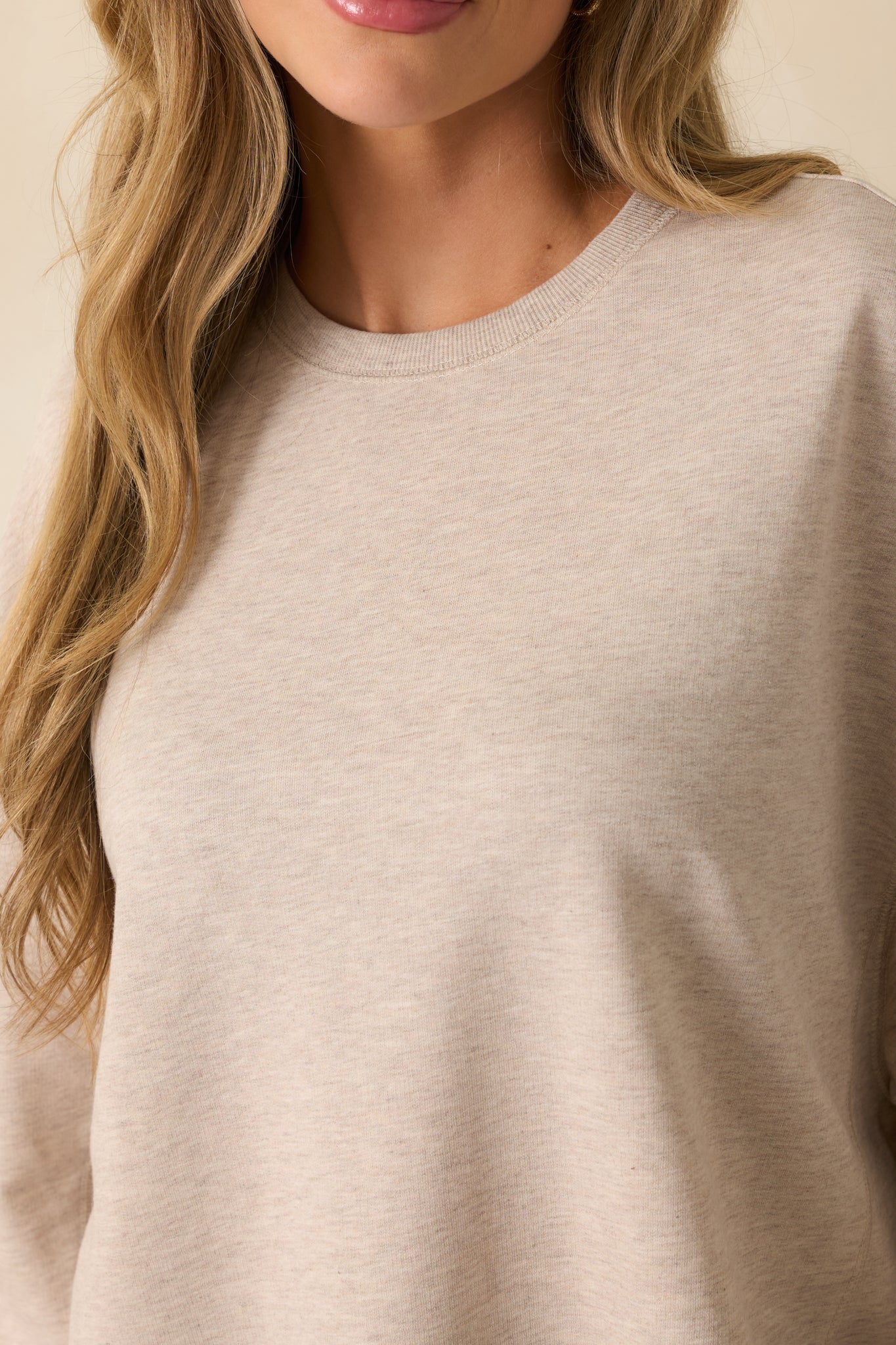 Close-up of the cotton-blend fabric, ribbed cuff, and subtle heather pattern, showcasing the texture and craftsmanship.