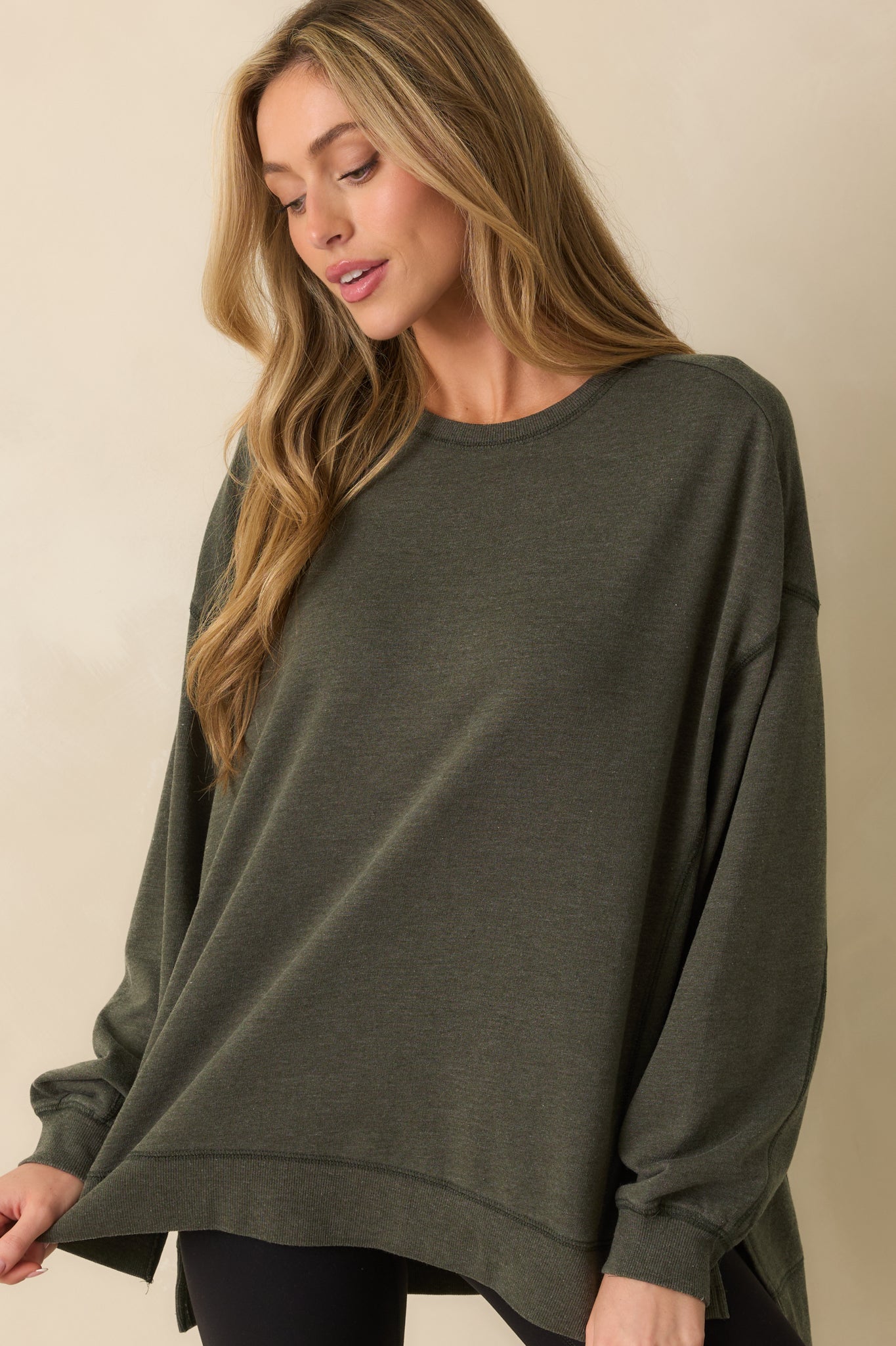 Cropped front view highlighting the ribbed cuff detail and relaxed sleeve fit.