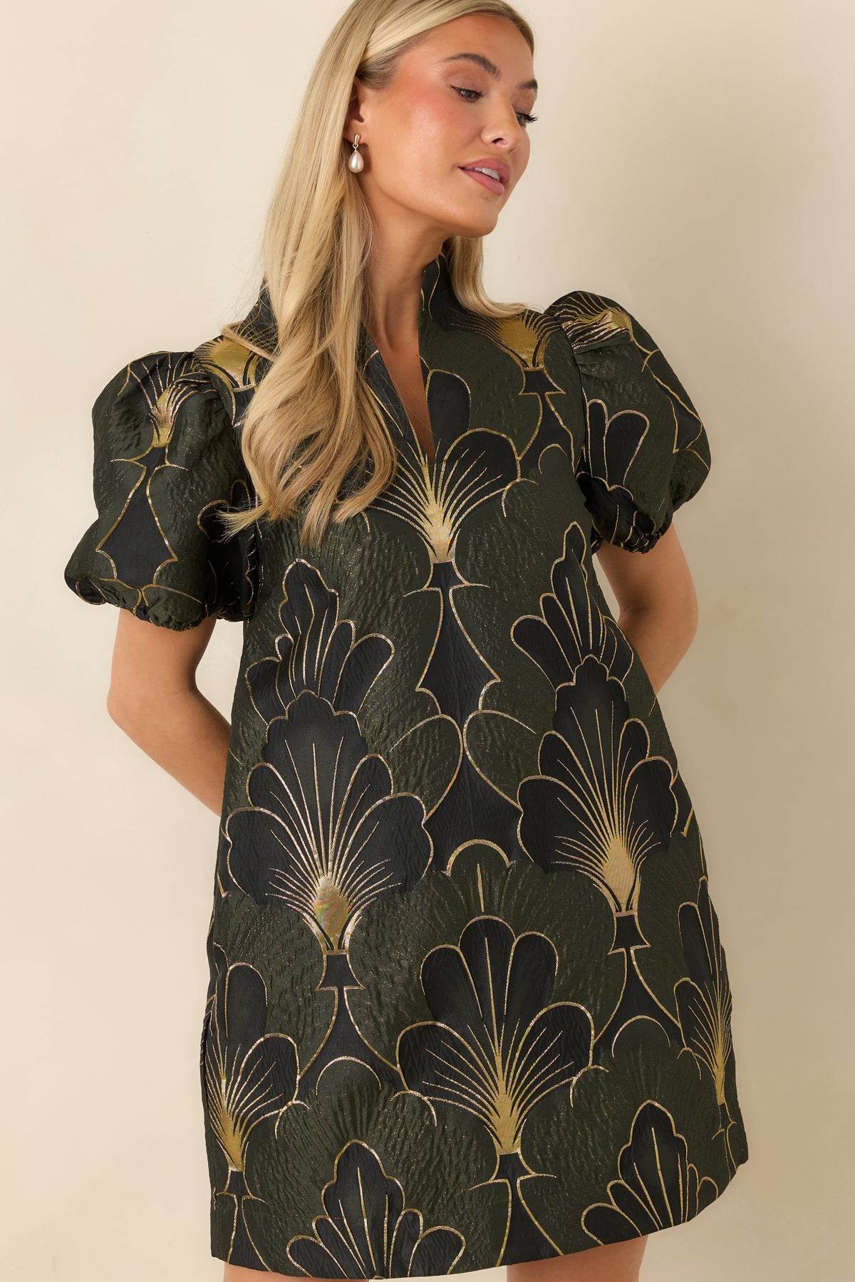 Split neckline and stand collar detail on the textured olive floral mini dress.