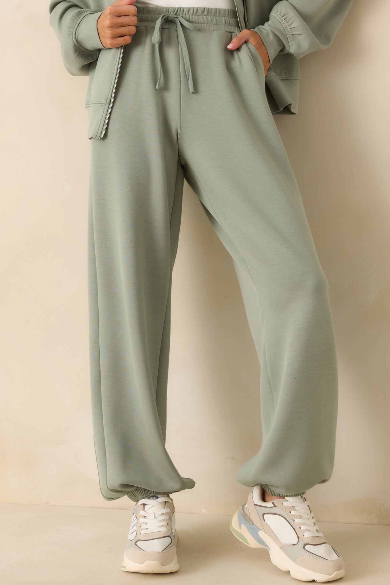 A cropped lower leg view highlighting the gathered ankle cuffs and clean hemline.