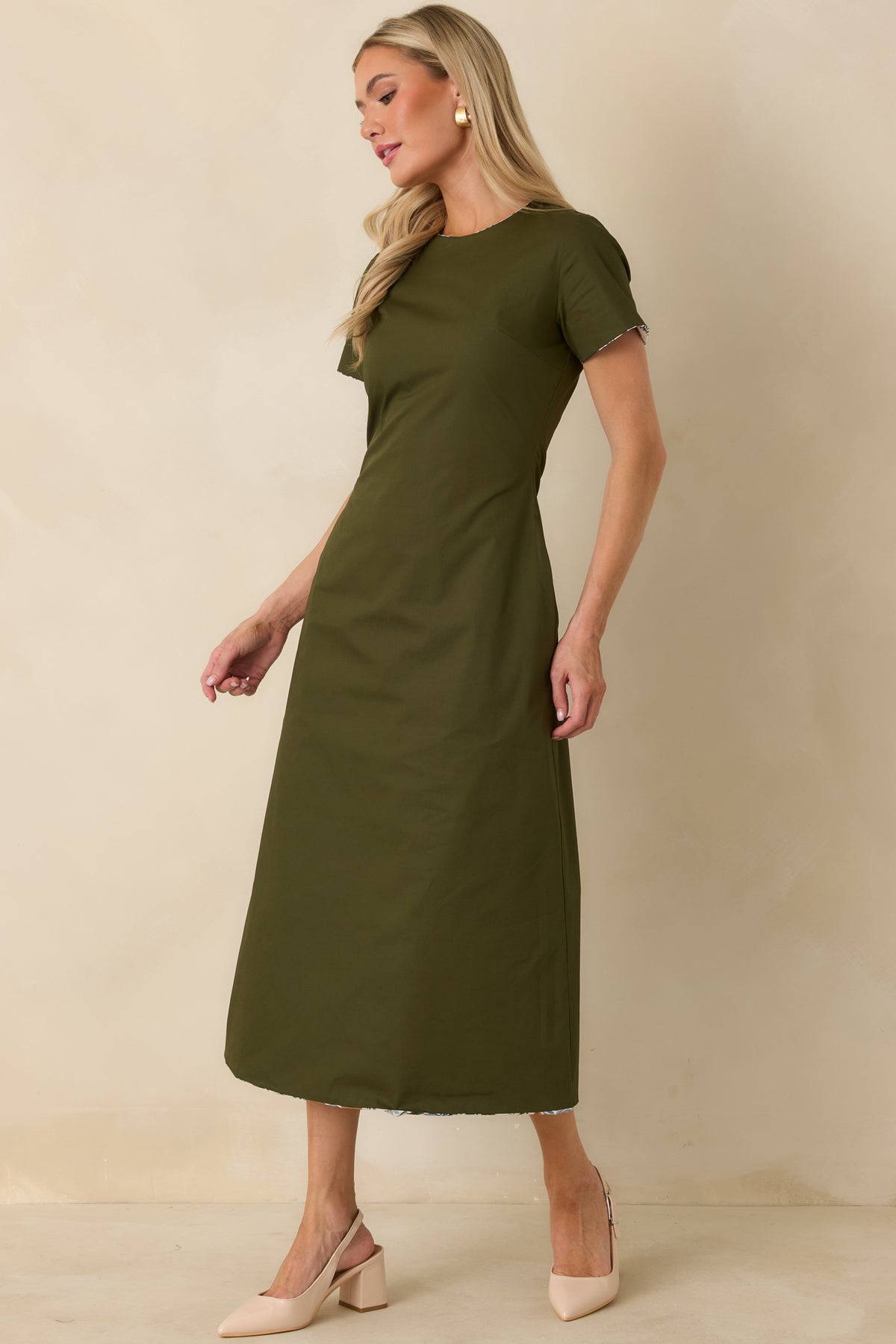 Solid olive green reversible cotton dress featuring a classic round neckline, short sleeves, and softly tailored A-line silhouette.