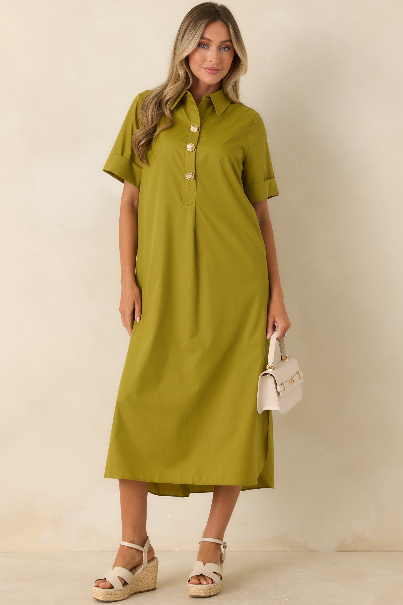 Classic shirt dress design in rich olive green with a partial button-front placket, flowing shape, and comfortable woven fabric.