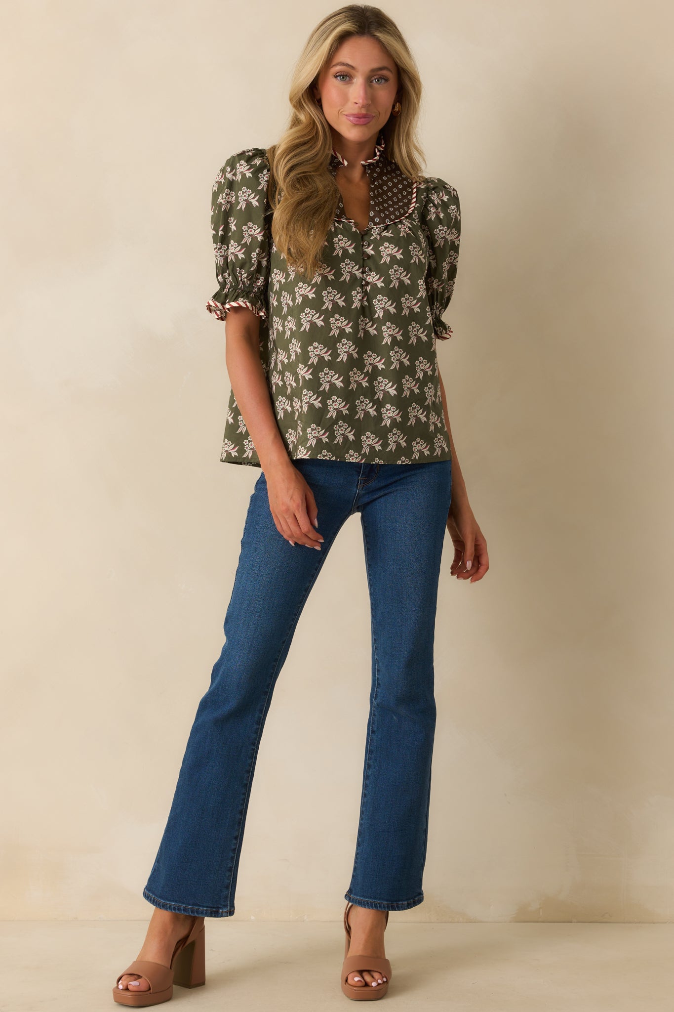 Olive base top with geometric yoke, puff sleeves, and decorative piping details.
