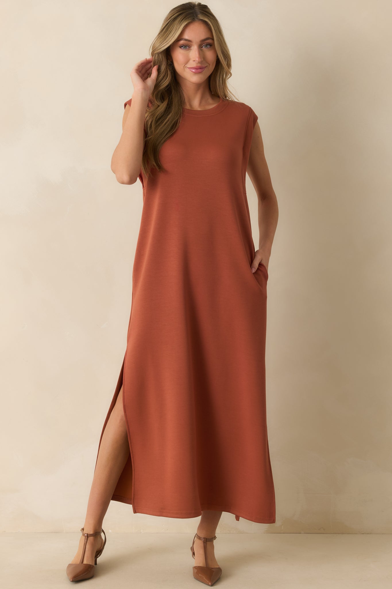 Ultra-soft orange maxi dress styled with cap sleeves, crew neck, and subtle side hem slits.