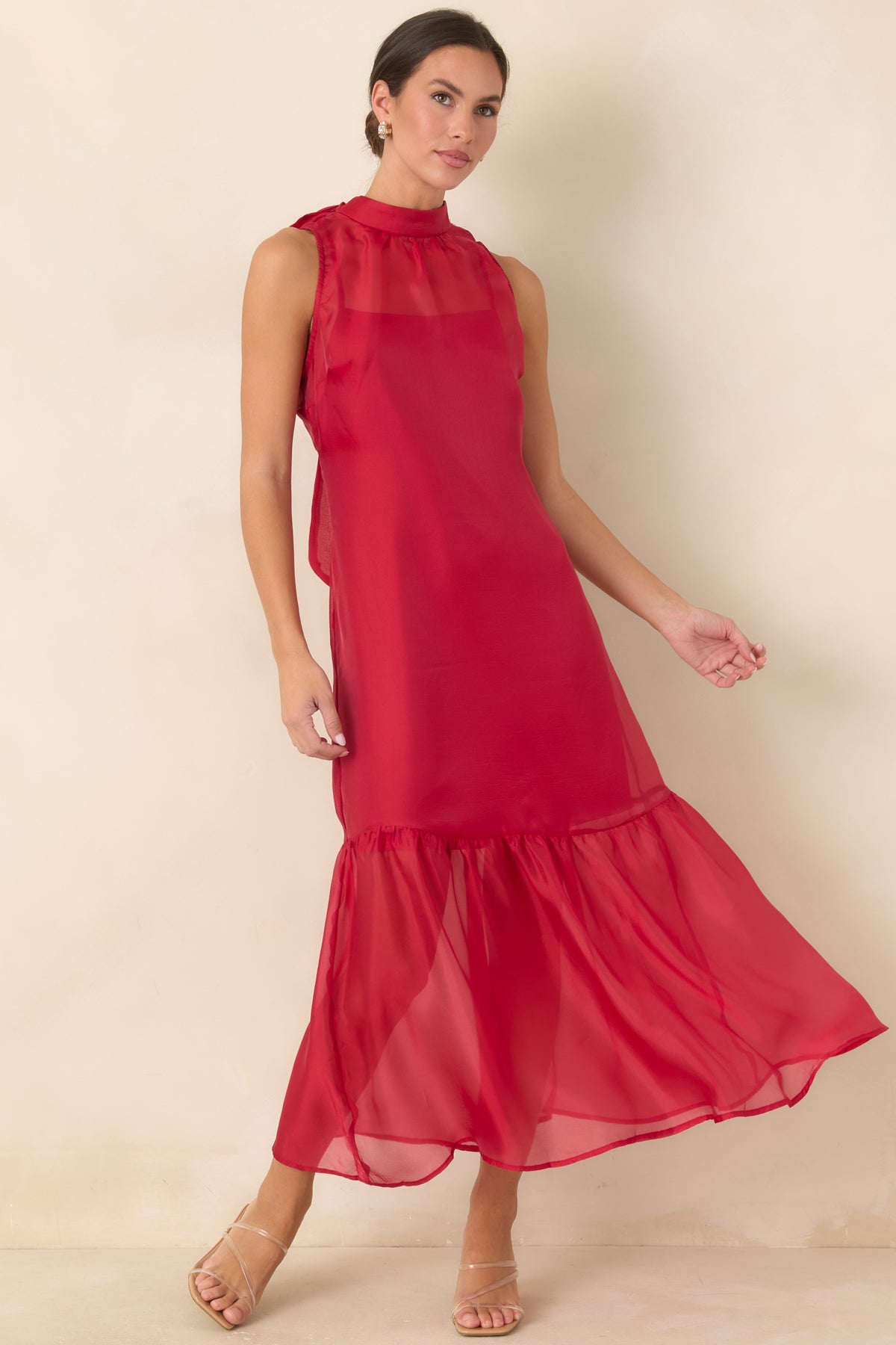 Organza maxi dress featuring a clean high neckline and a graceful floor-length silhouette.