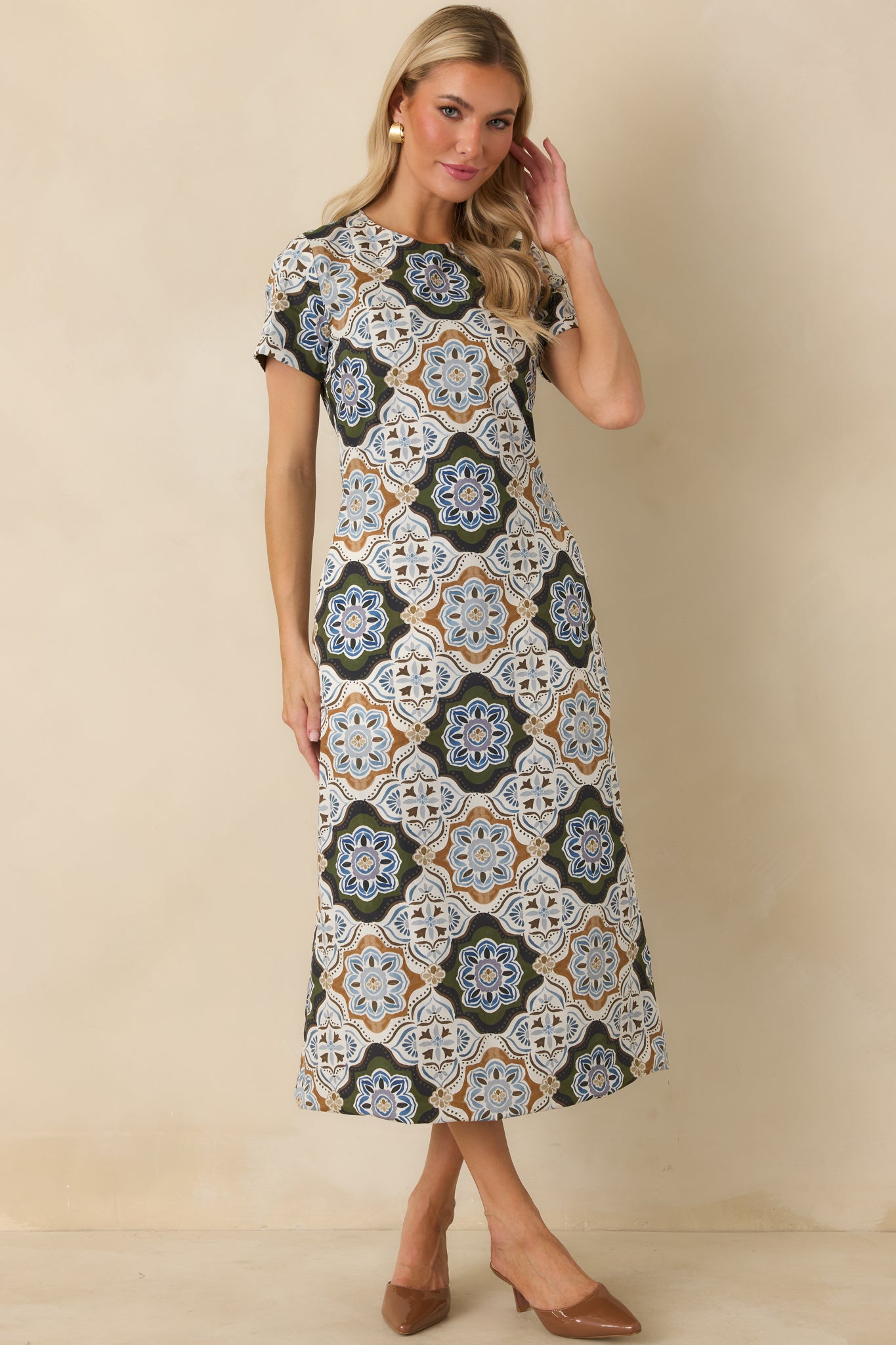 Ornate medallion dress featuring olive, blue, ivory, and camel tones in a softly tailored A-line silhouette