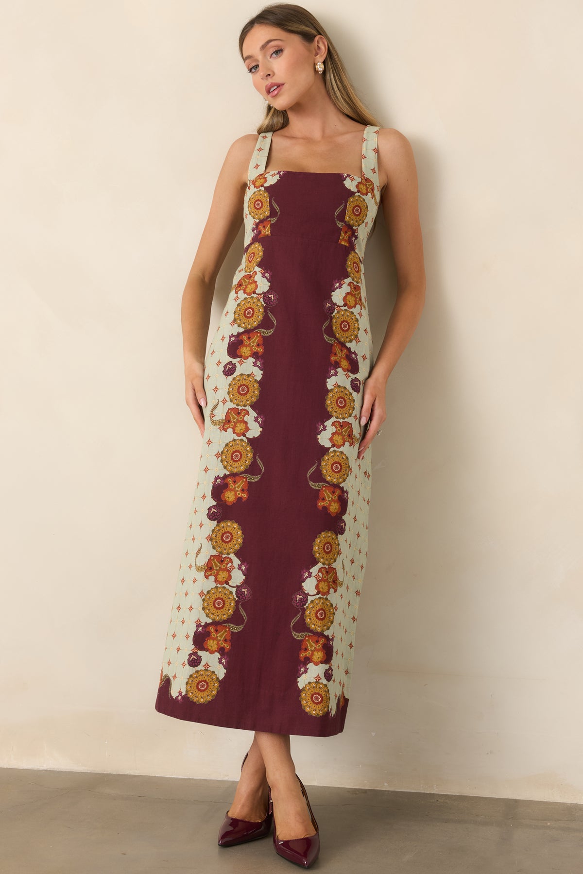 Ornate printed midi dress with a clean square neckline, wide straps, and softly flowing skirt.