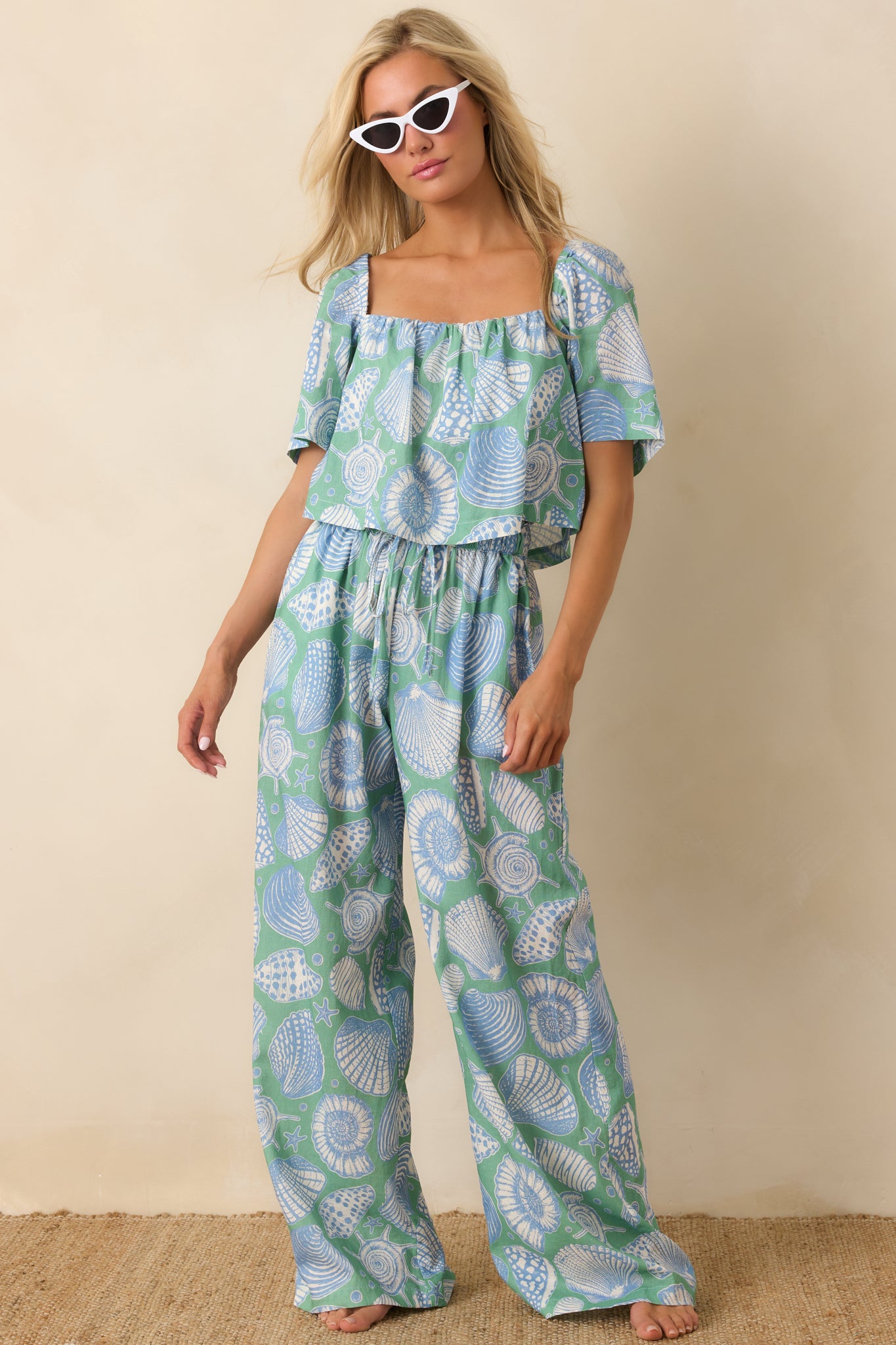Front view of lightweight cotton pants featuring fluid wide-leg silhouette and breathable design.