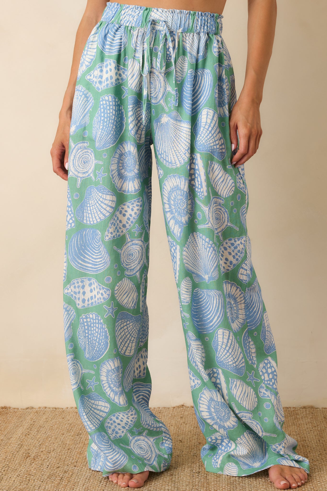 Front crop of blue multi pants highlighting elastic waistband and drawstring tie detail.