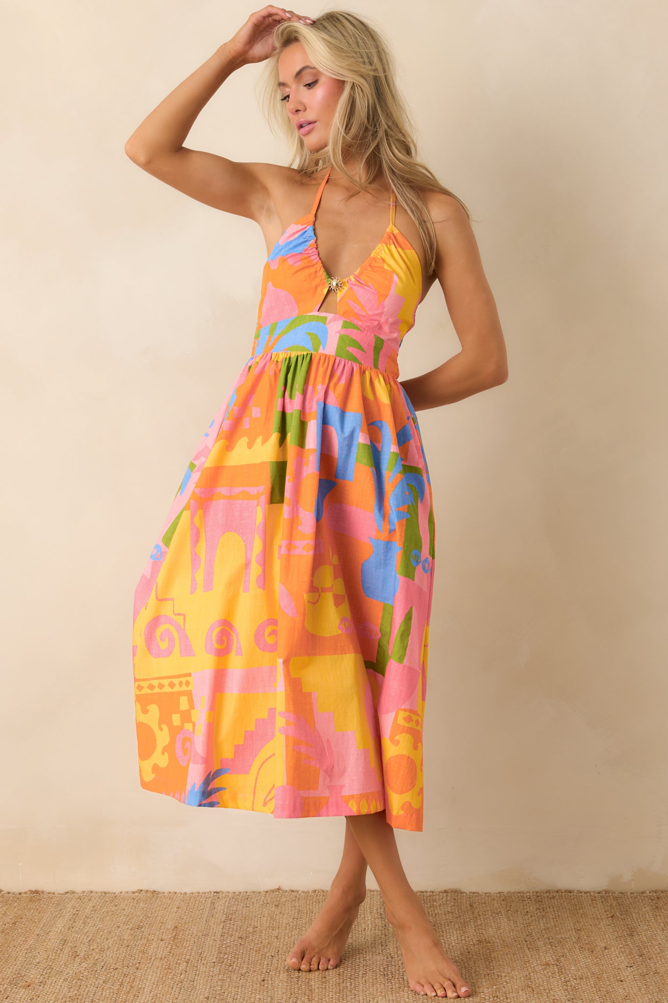 Cotton poplin midi dress with sculpted bodice and bold graphic print design.