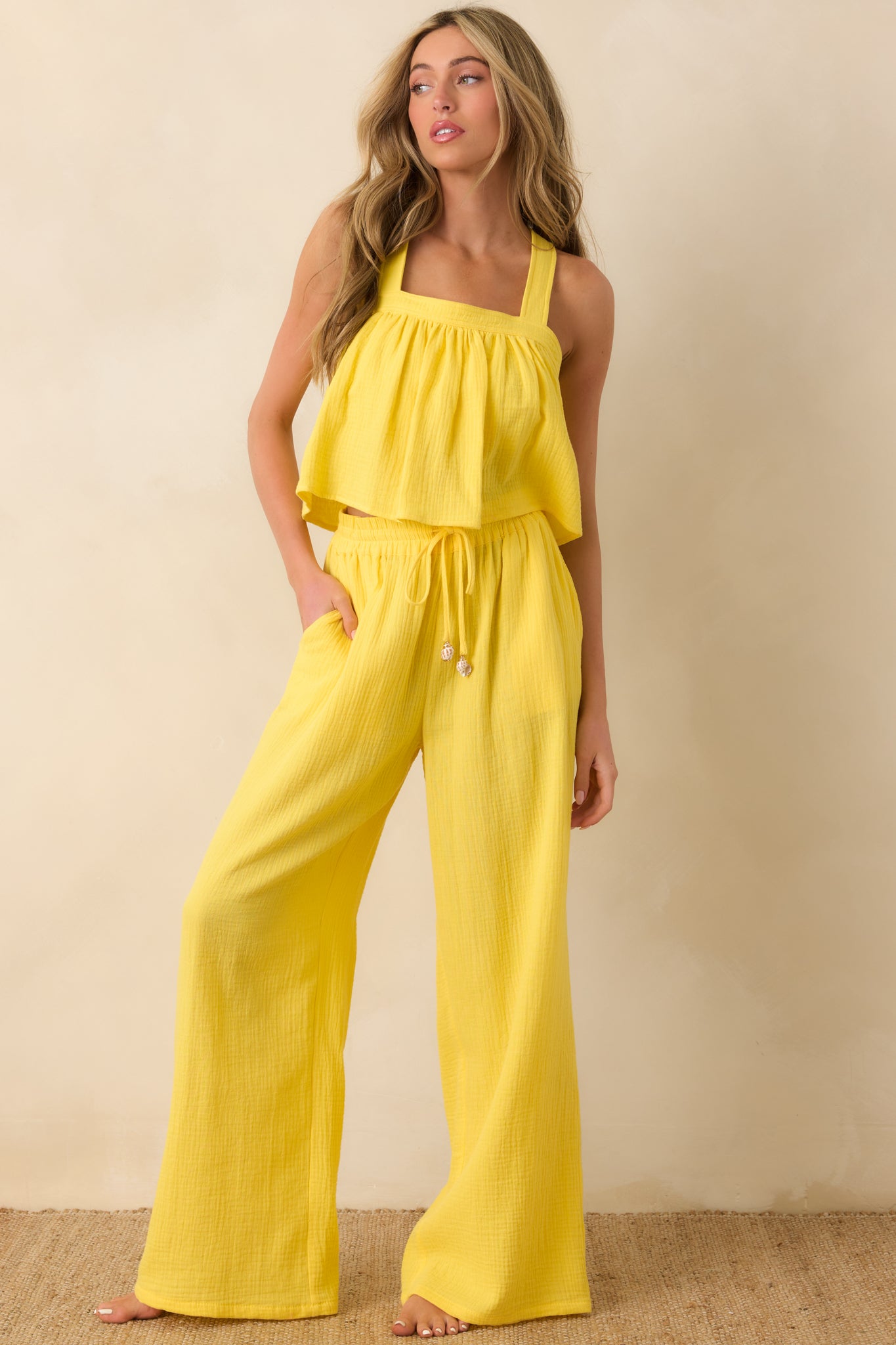 Sunny yellow wide-leg pants with drawstring waist and easy, breezy drape.