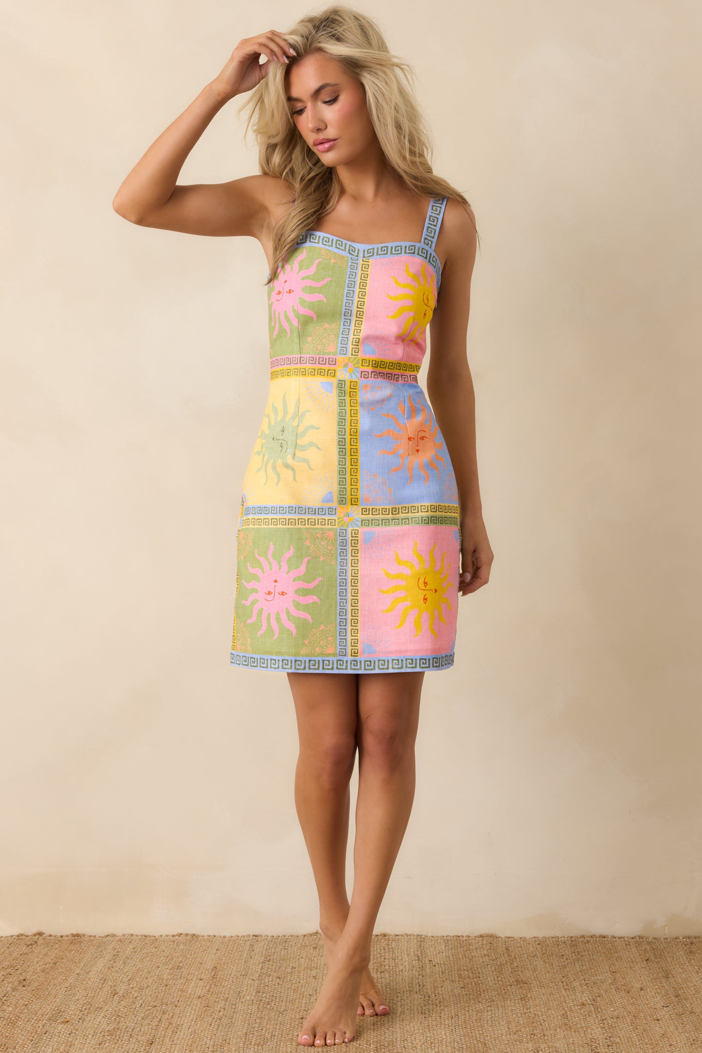 Colorful patchwork mini dress showcasing a structured shape with a flattering fitted design and a clean square neckline.