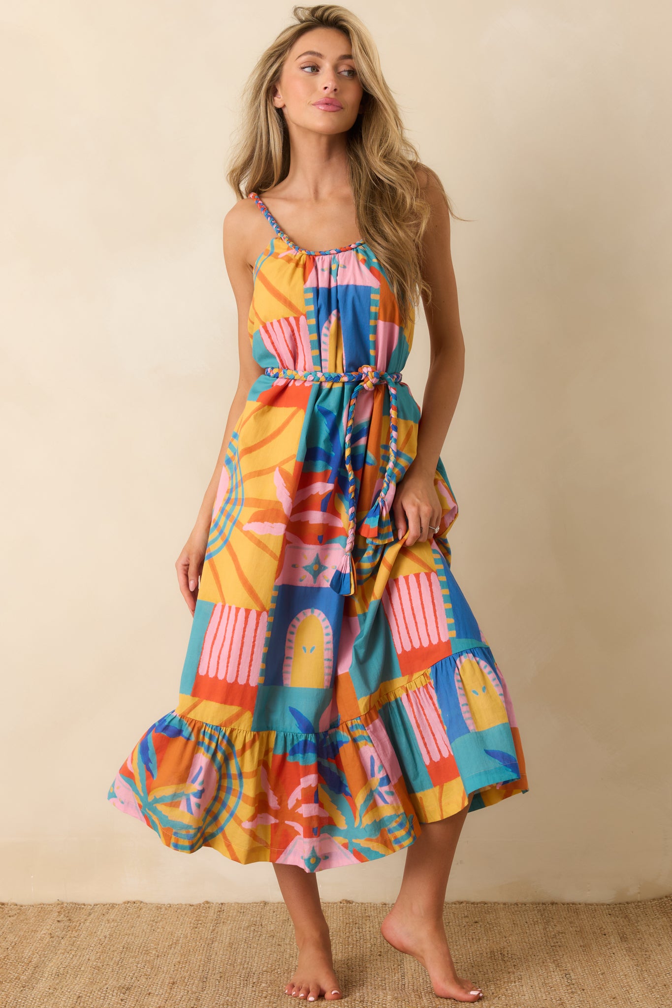 Multi print midi dress featuring a relaxed breezy fit, tiered skirt design, and removable braided waist tie for adjustable shaping.