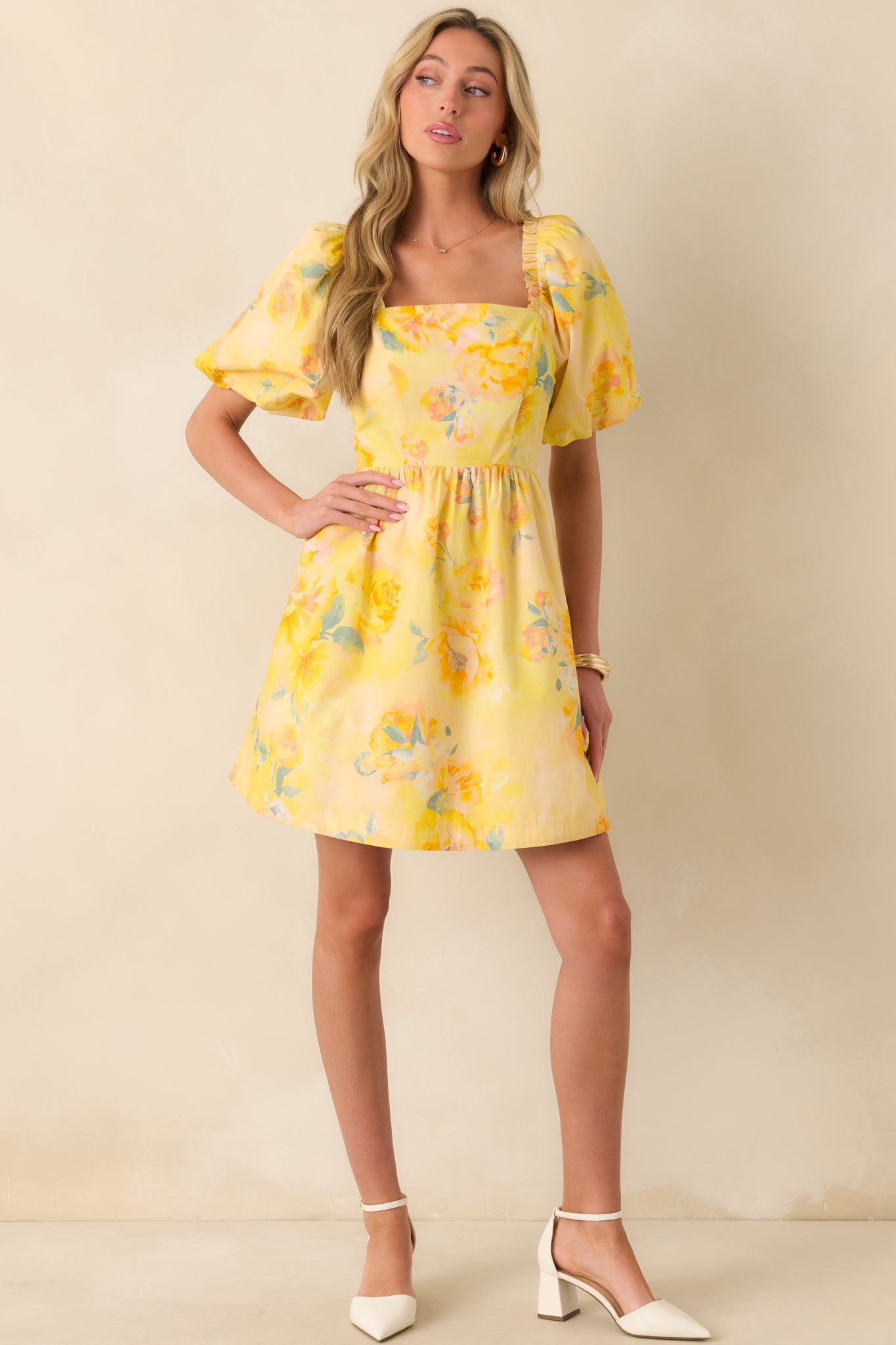 Romantic mini dress with square neckline, fitted bodice, and softly flared skirt for effortless movement.
