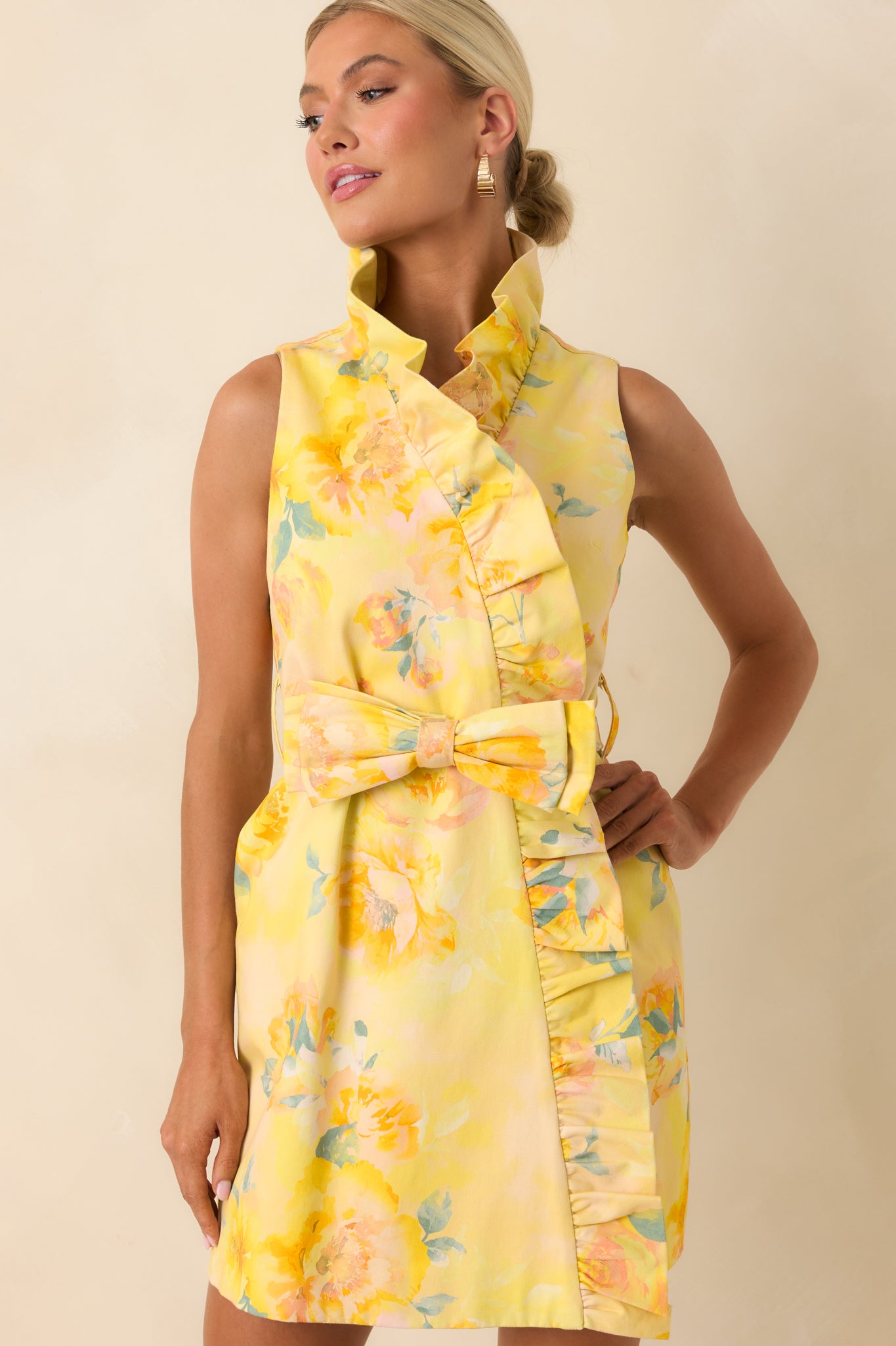 Detailed look at faux wrap skirt with ruffle trim and smooth silky woven texture.