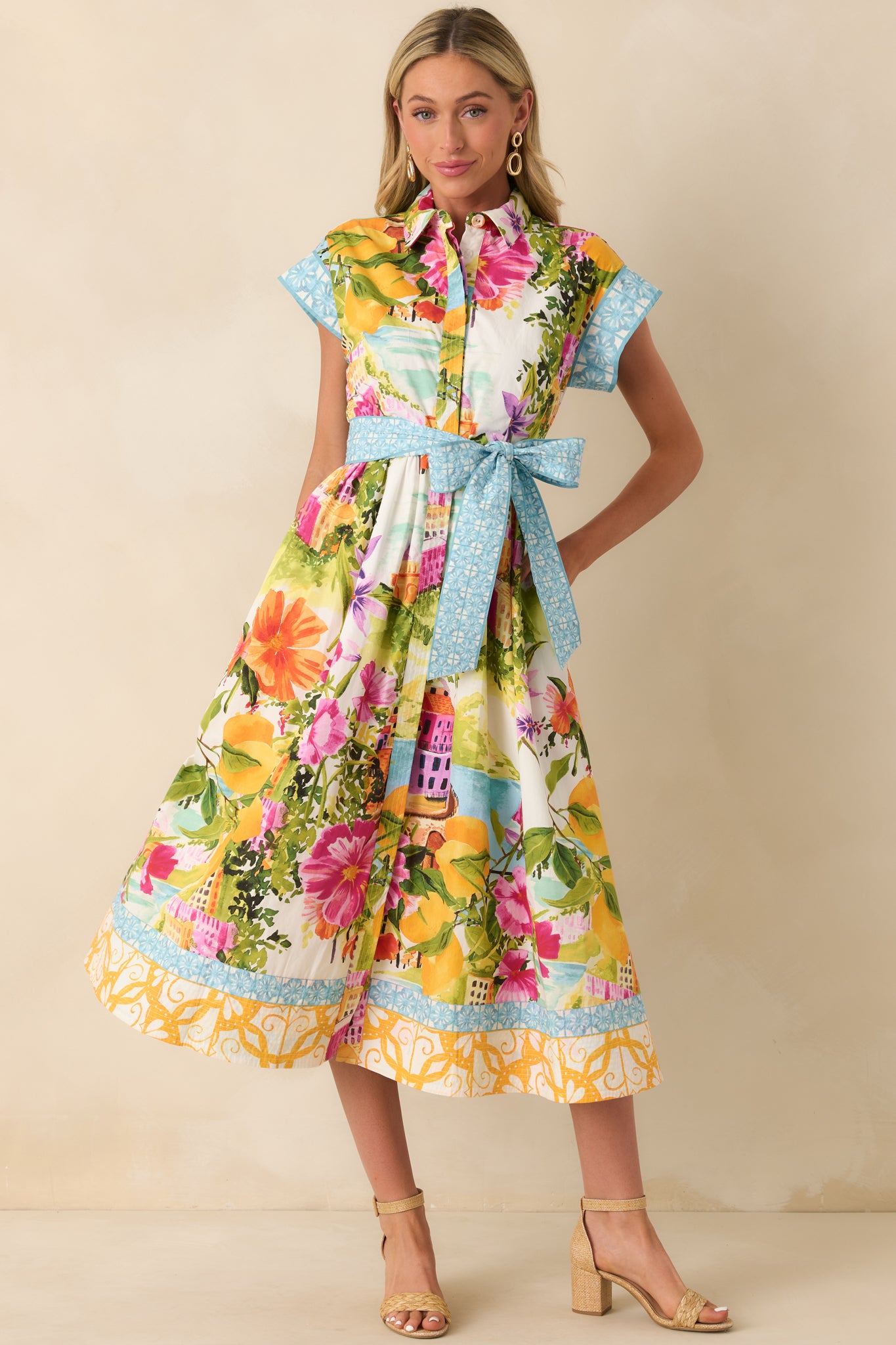 Midi dress with structured bodice, matching belt, and full flowing skirt.