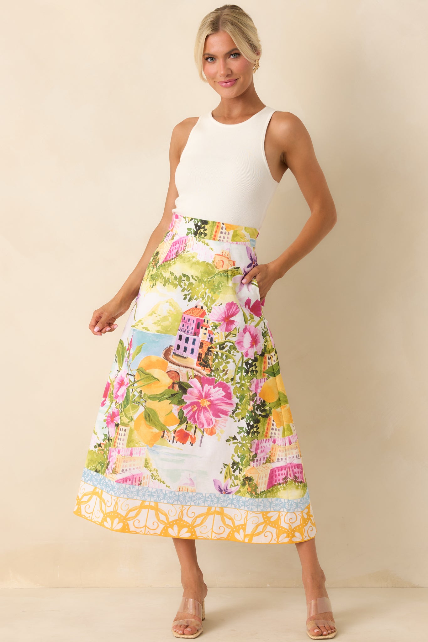 High-rise A-line skirt in linen-cotton blend with a softly structured drape and contrast border hem detail.