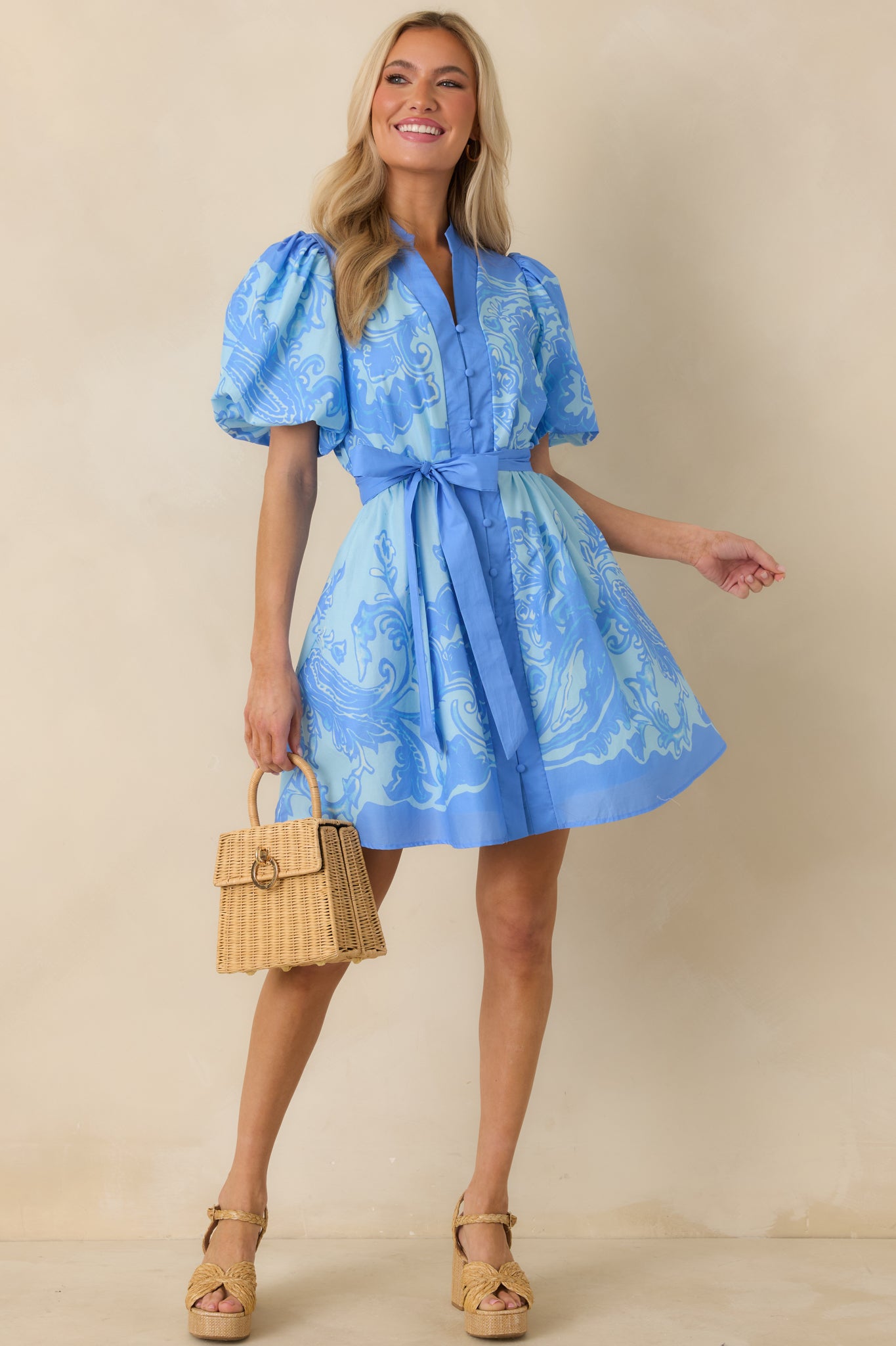 Paisley mini dress showcasing the balanced proportions of the button-front bodice and easy, breathable cotton fabric.