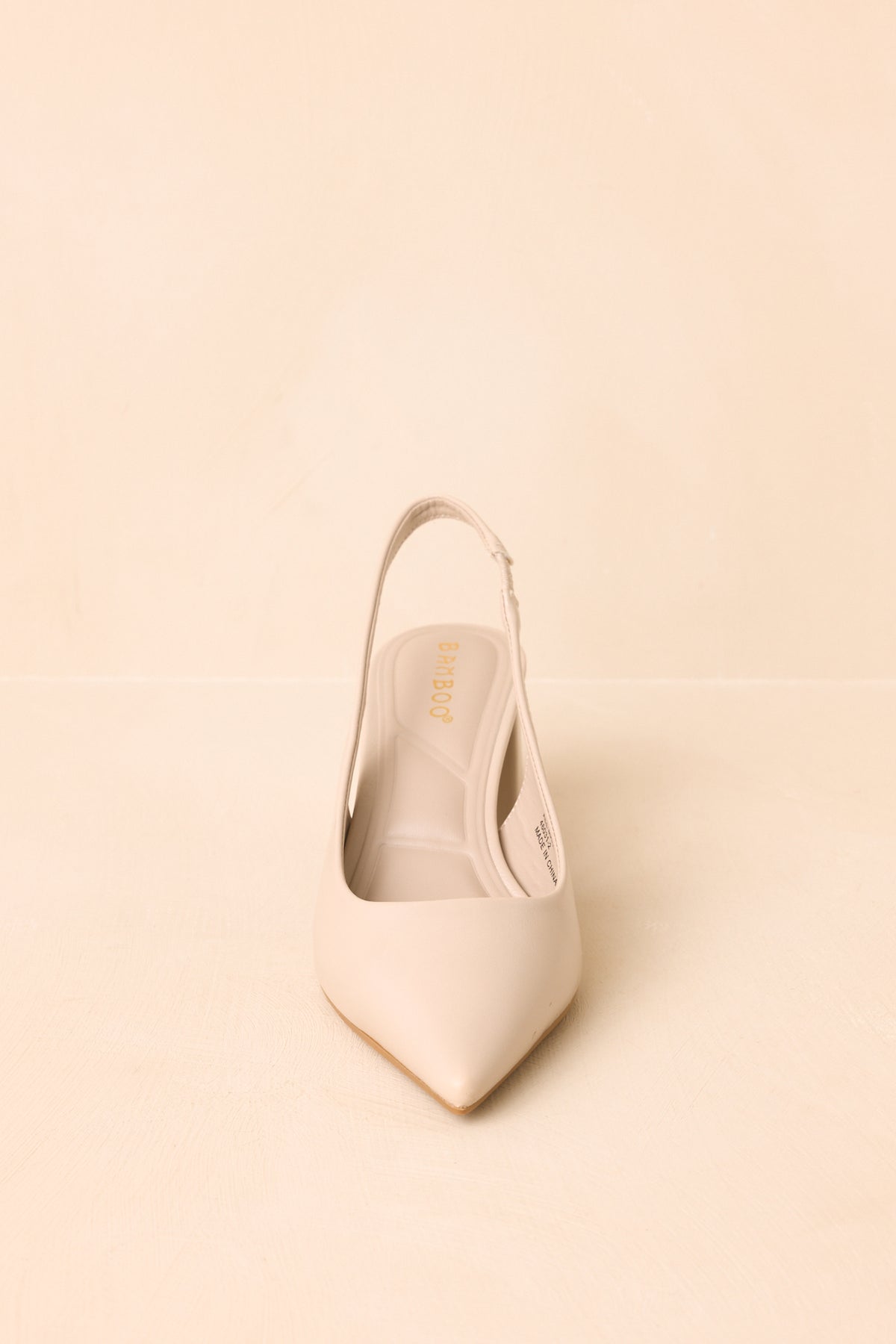 Pearl heels display the pointed toe and thick block heel in a clean angled profile.