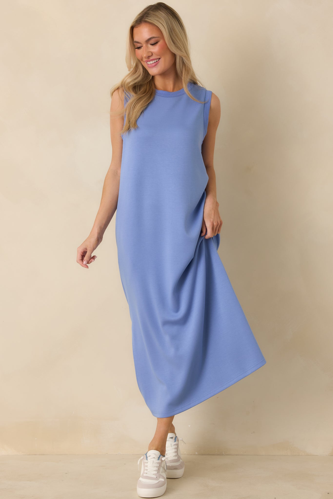 Periwinkle blue jersey knit maxi dress showing the easy, straight fit and comfortable flow through the full length.