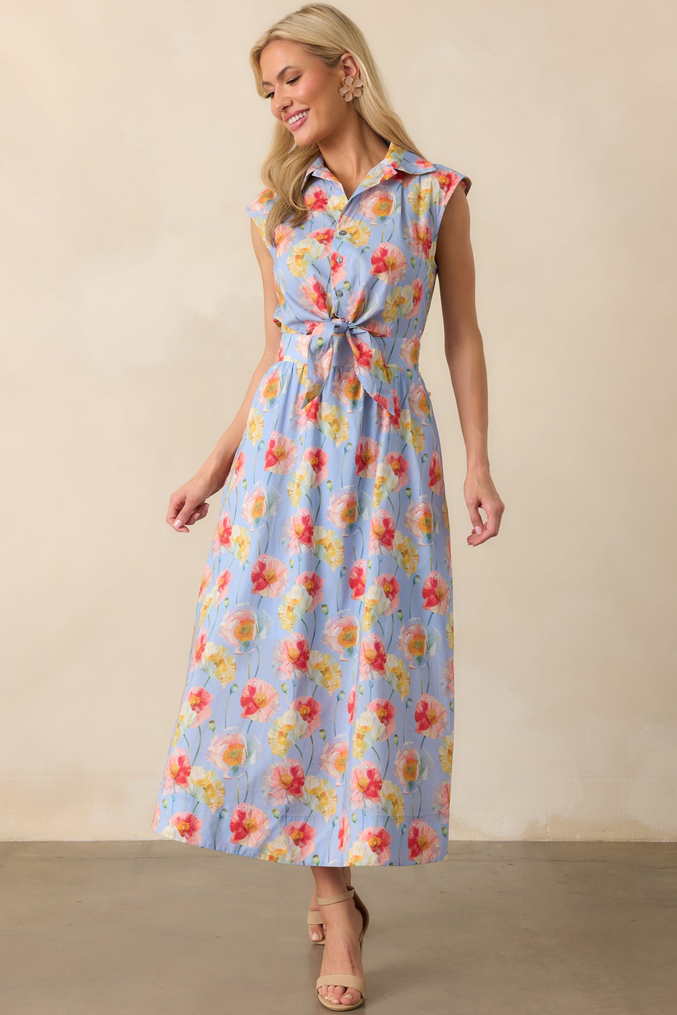 Periwinkle maxi dress featuring a multicolor poppy floral print, button front bodice, and adjustable self-tie at the waist shown front-facing.