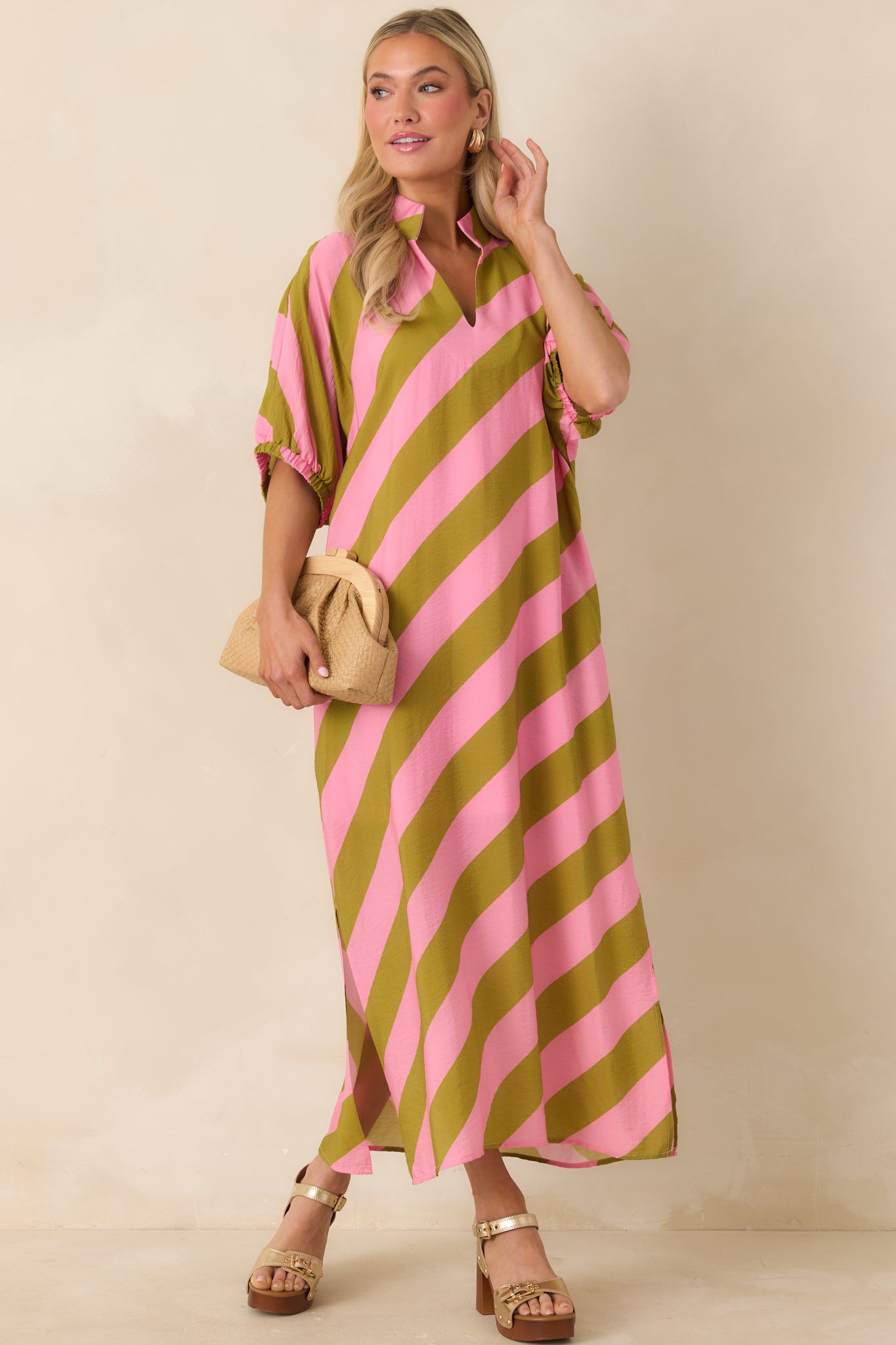 Pink and olive green striped maxi dress with collared neckline, split V-front, and relaxed fit.