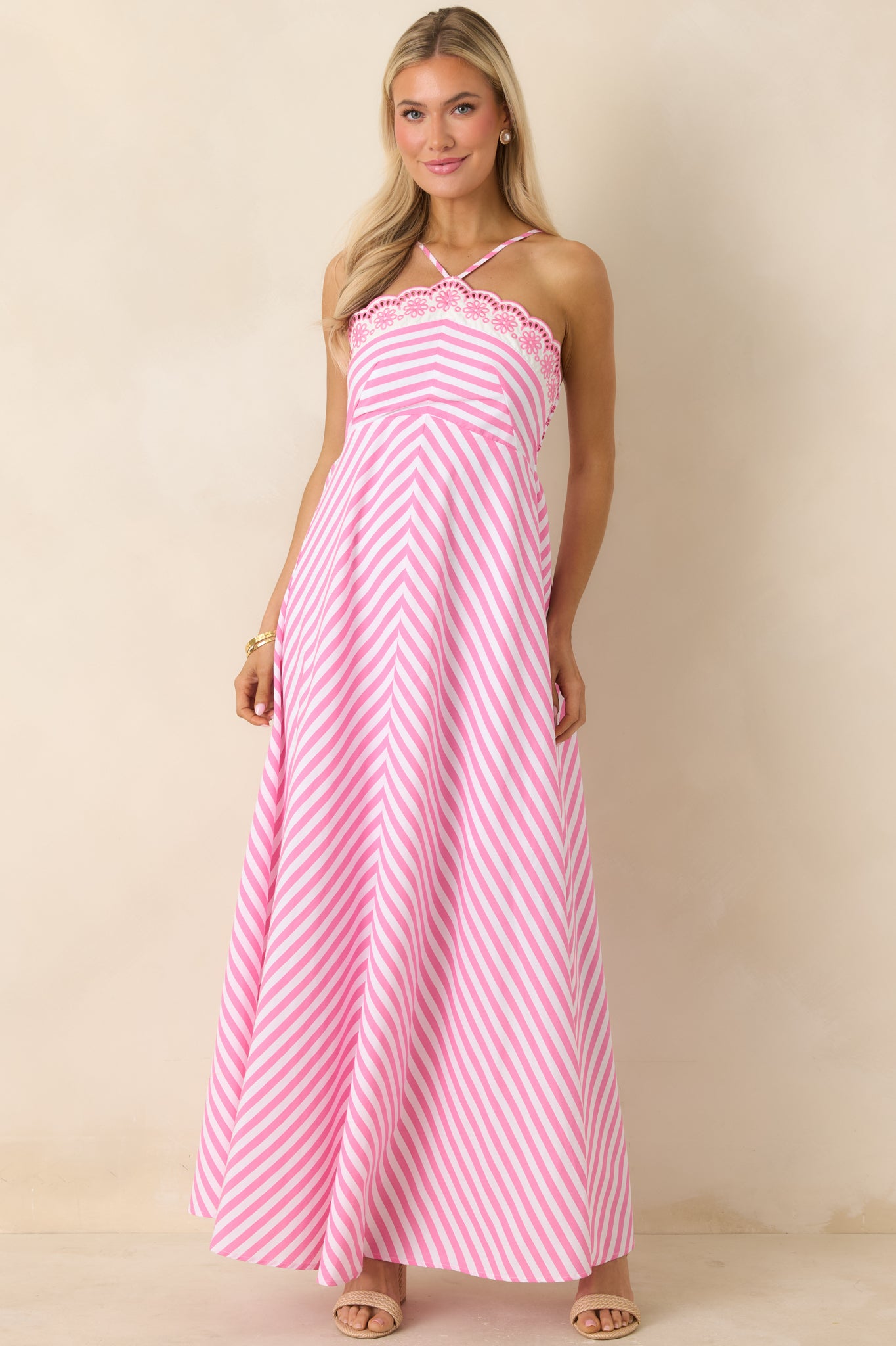 Pink and white striped maxi dress with halter neckline and smocked back.