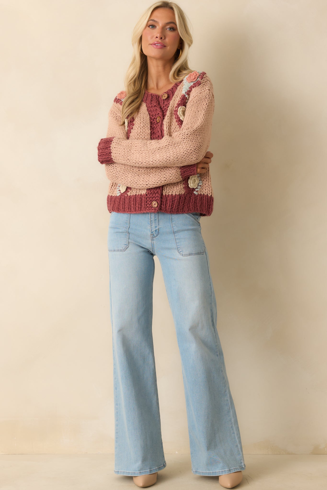 Relaxed fit pink cardigan featuring long sleeves and contrast ribbed trim