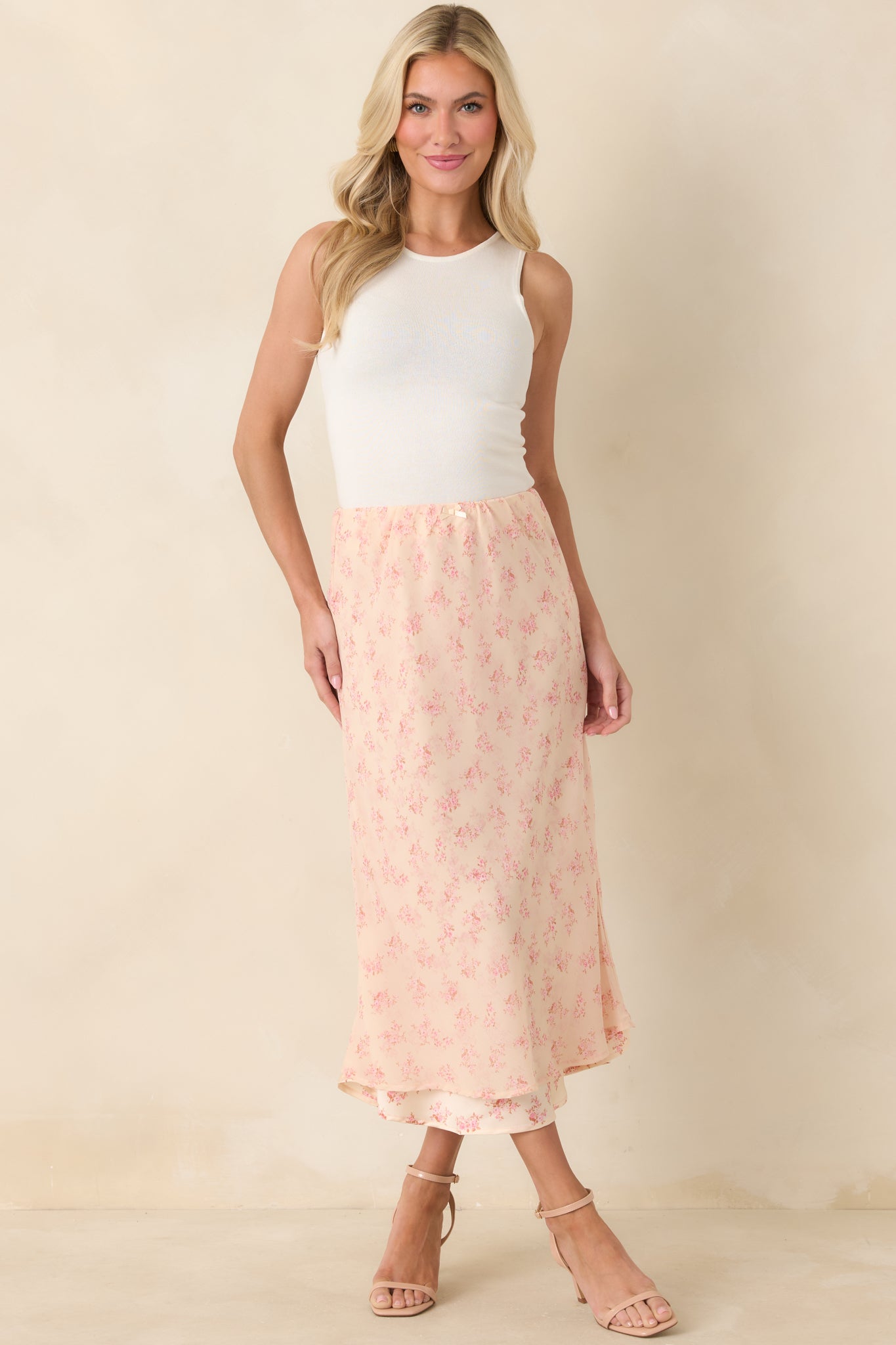 Pink floral chiffon midi skirt with a lightweight feel and softly layered hem that moves beautifully with every step.
