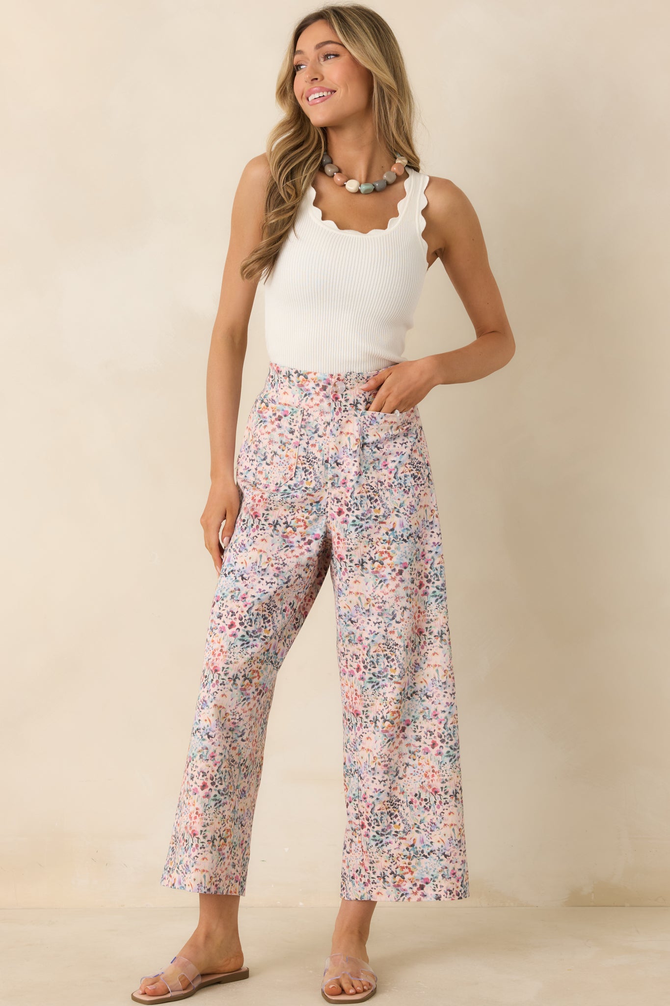 Pink floral cotton pants with structured waistband, wide leg fit, and relaxed silhouette.