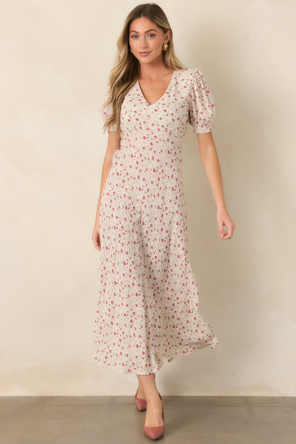 Pink floral maxi dress designed with a flattering V-neckline, softly gathered waist, and subtle leg slit.
