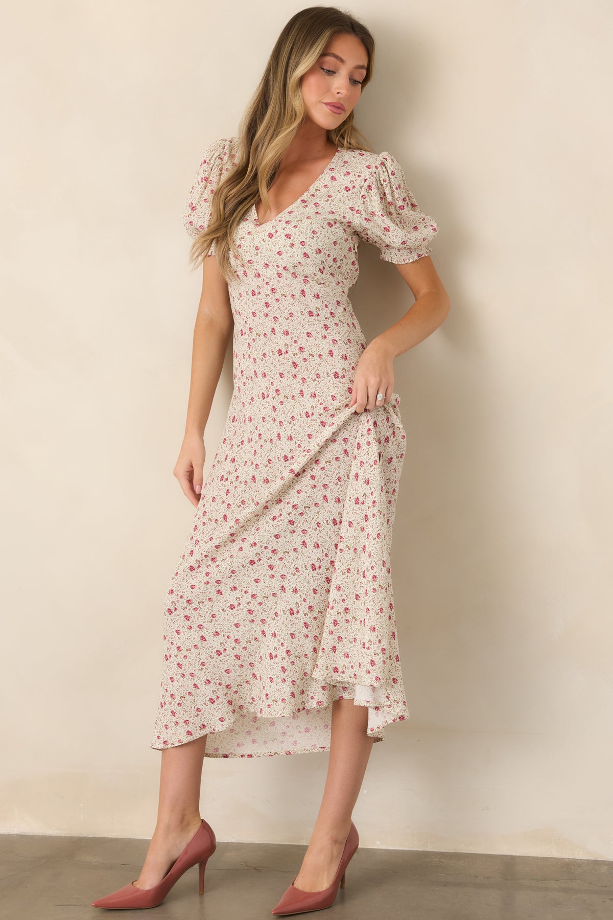 Pink multicolor floral maxi dress featuring a V-neckline, short puff sleeves, elastic waist, and small leg slit.