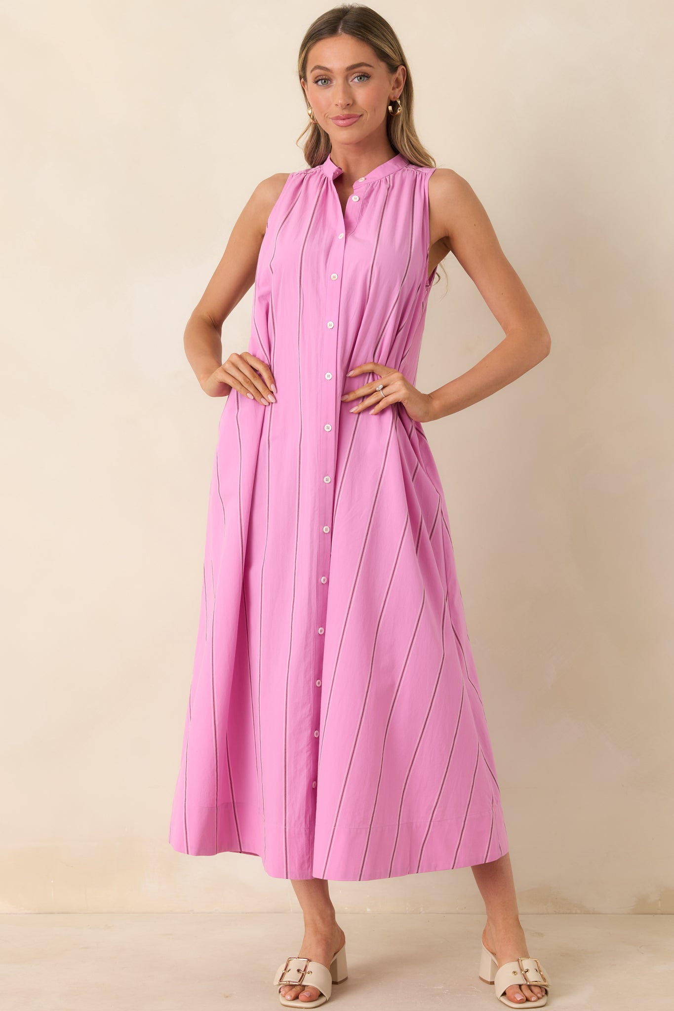 Pink stripe dress with gathered yoke and flowing, relaxed shape.