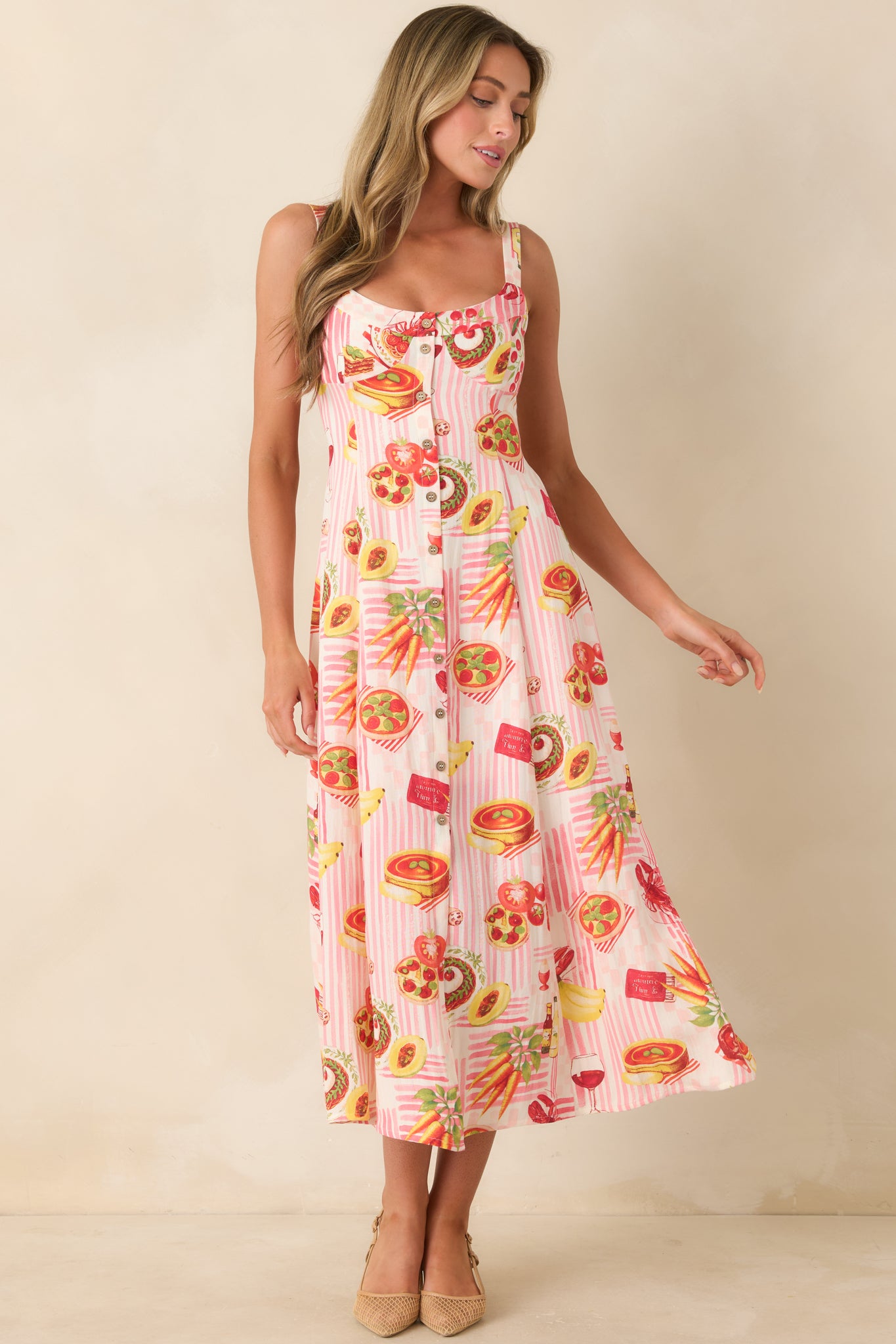 Colorful food print pink striped midi dress featuring a comfortable relaxed fit, adjustable shoulder straps, and effortless midi-length style.