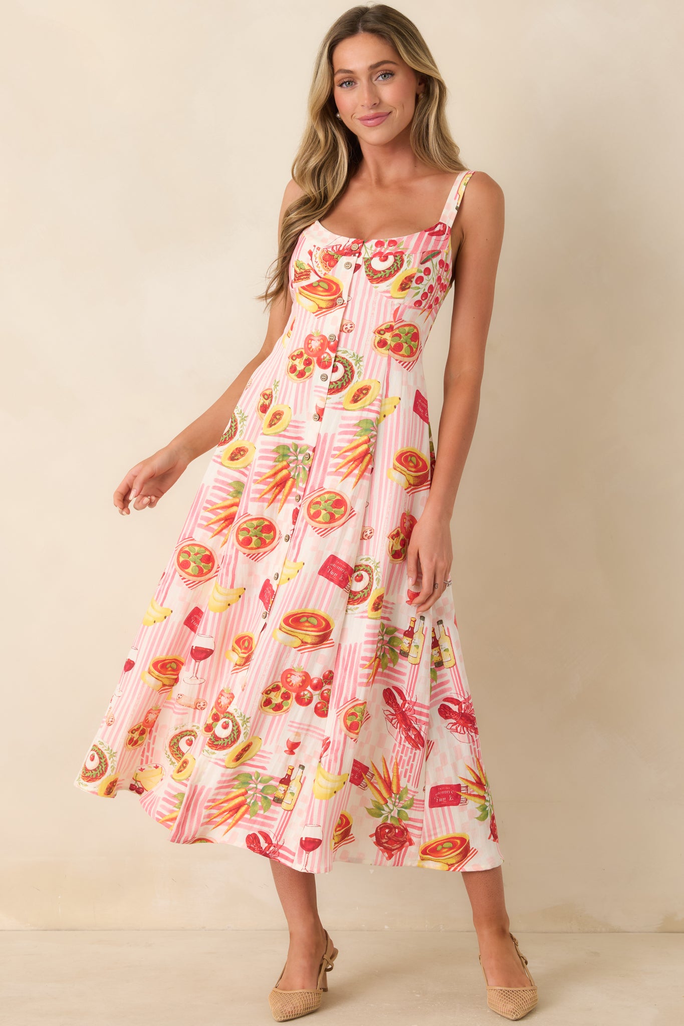 Pink striped midi dress highlighting its fun novelty print, easygoing silhouette, scoop neckline, and classic button-down front.
