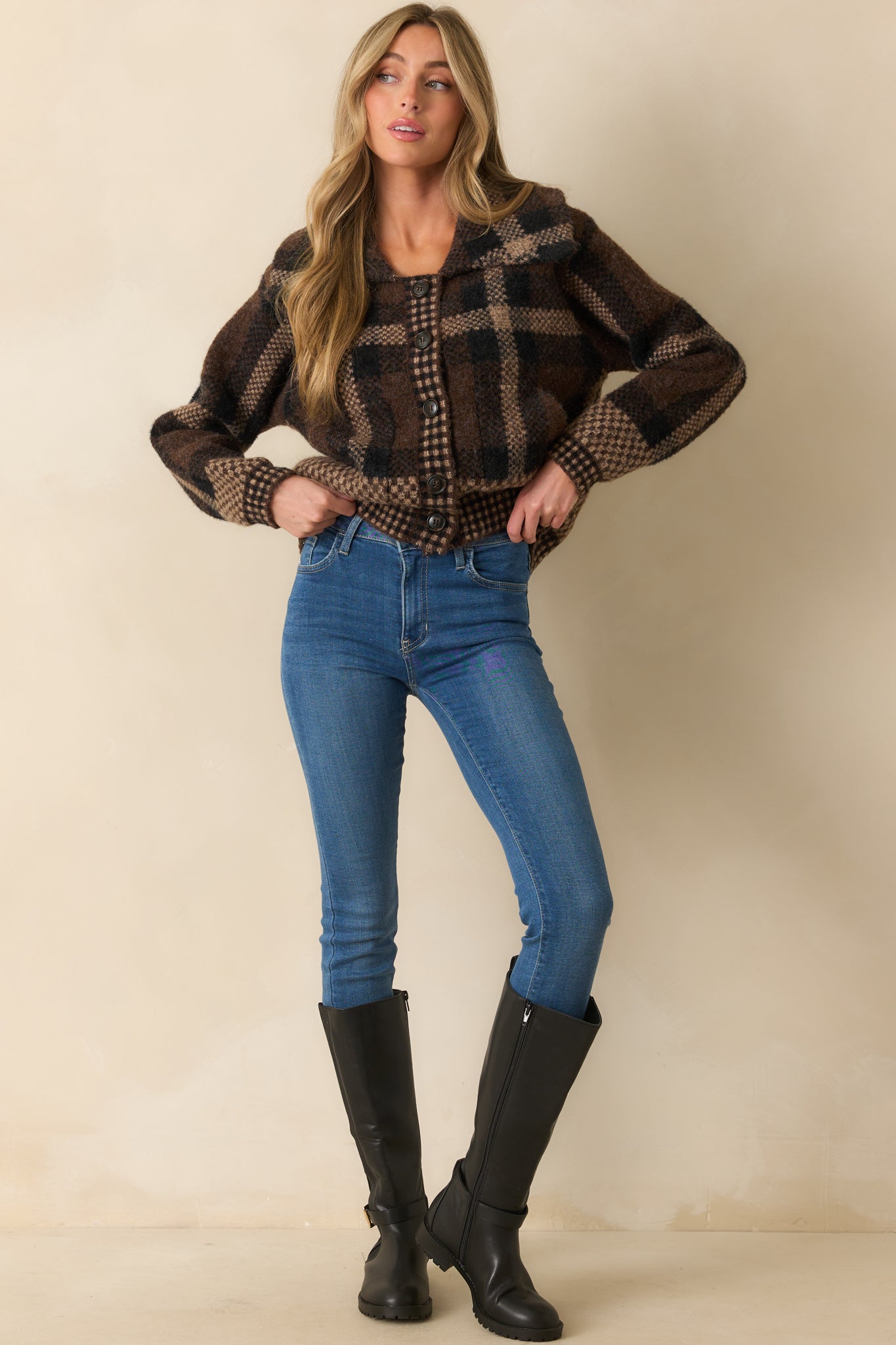 Tailored plaid cardigan with wide collar and structured button-front design.