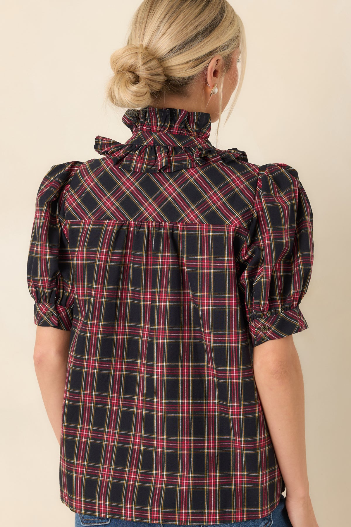 Rear view of the plaid cotton blouse showing the gathered back yoke and relaxed fit.