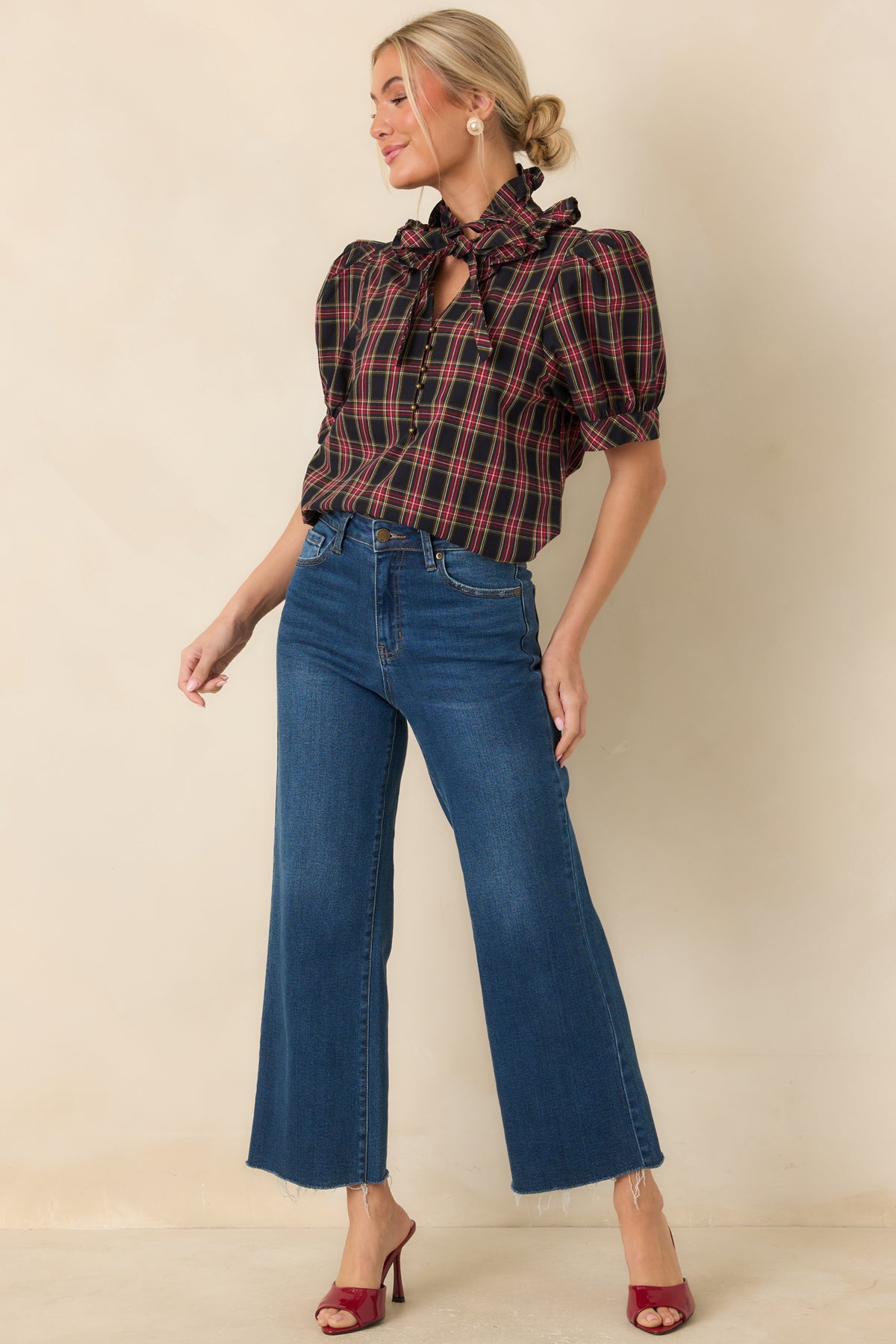 Plaid cotton top with a statement neck bow, relaxed silhouette, and fitted puff sleeve cuffs.