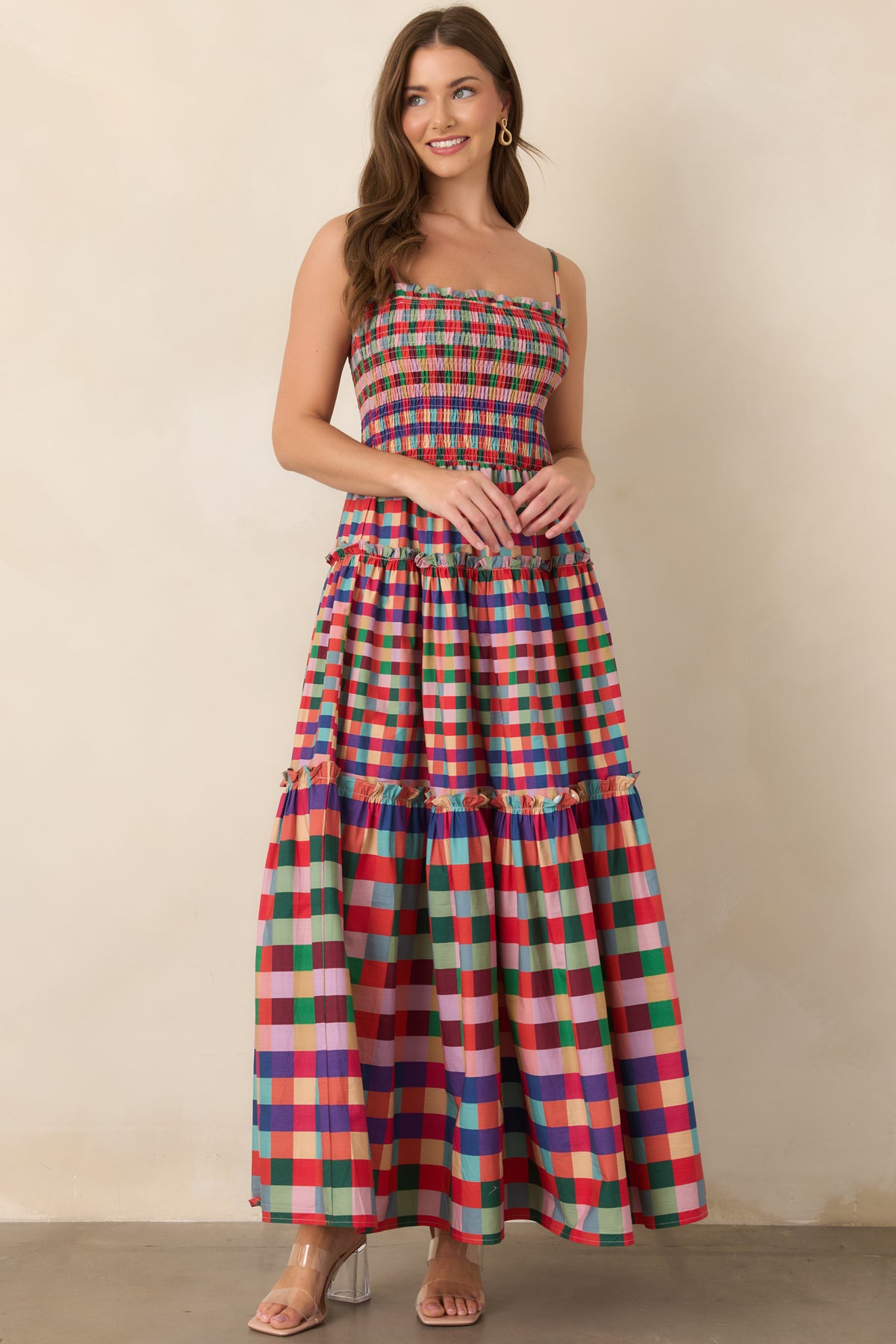Plaid maxi dress featuring a fully smocked bodice and flowing tiered A-line skirt.