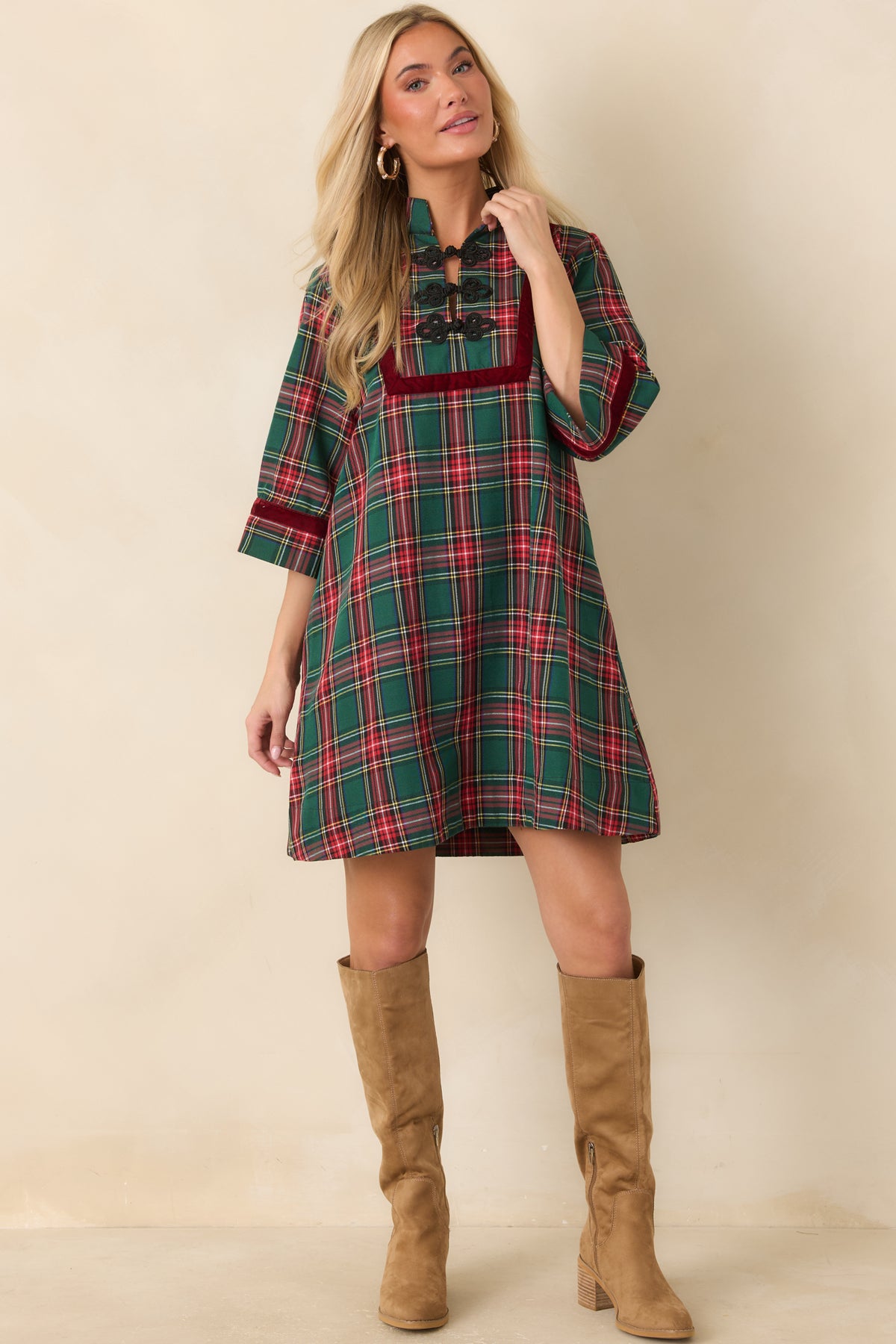 Plaid mini dress with burgundy velvet sleeve trim, a relaxed fit, and functional side pockets.