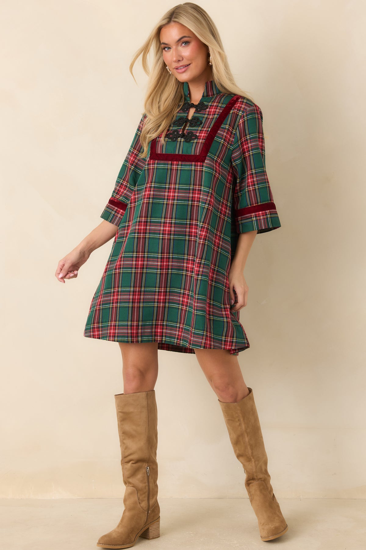 Classic plaid mini dress with three-quarter sleeves, black frog closures, and contrasting burgundy trim.