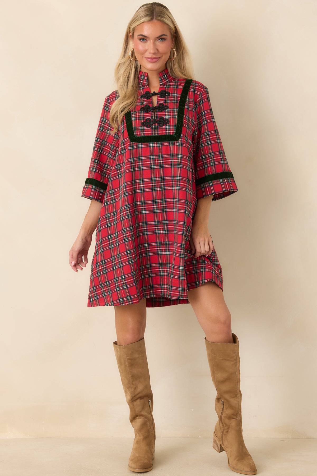 Festive plaid mini dress with velvet-trimmed sleeves, a defined front panel, and an easy A-line shape.