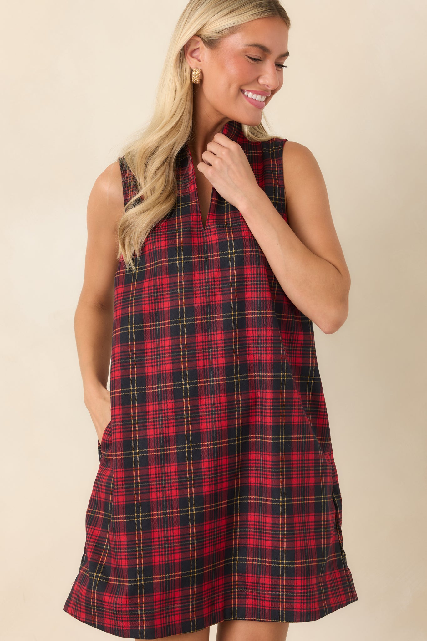The front of this plaid mini dress highlights the structured neckline and split front detail.