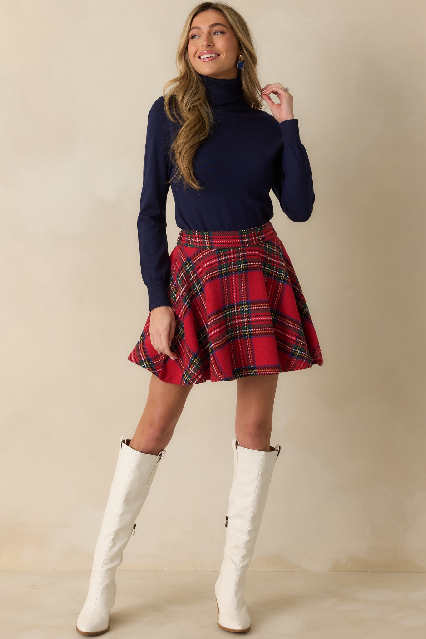 Plaid mini skirt showcasing soft woven fabric, smooth drape, and classic A-line shape.
