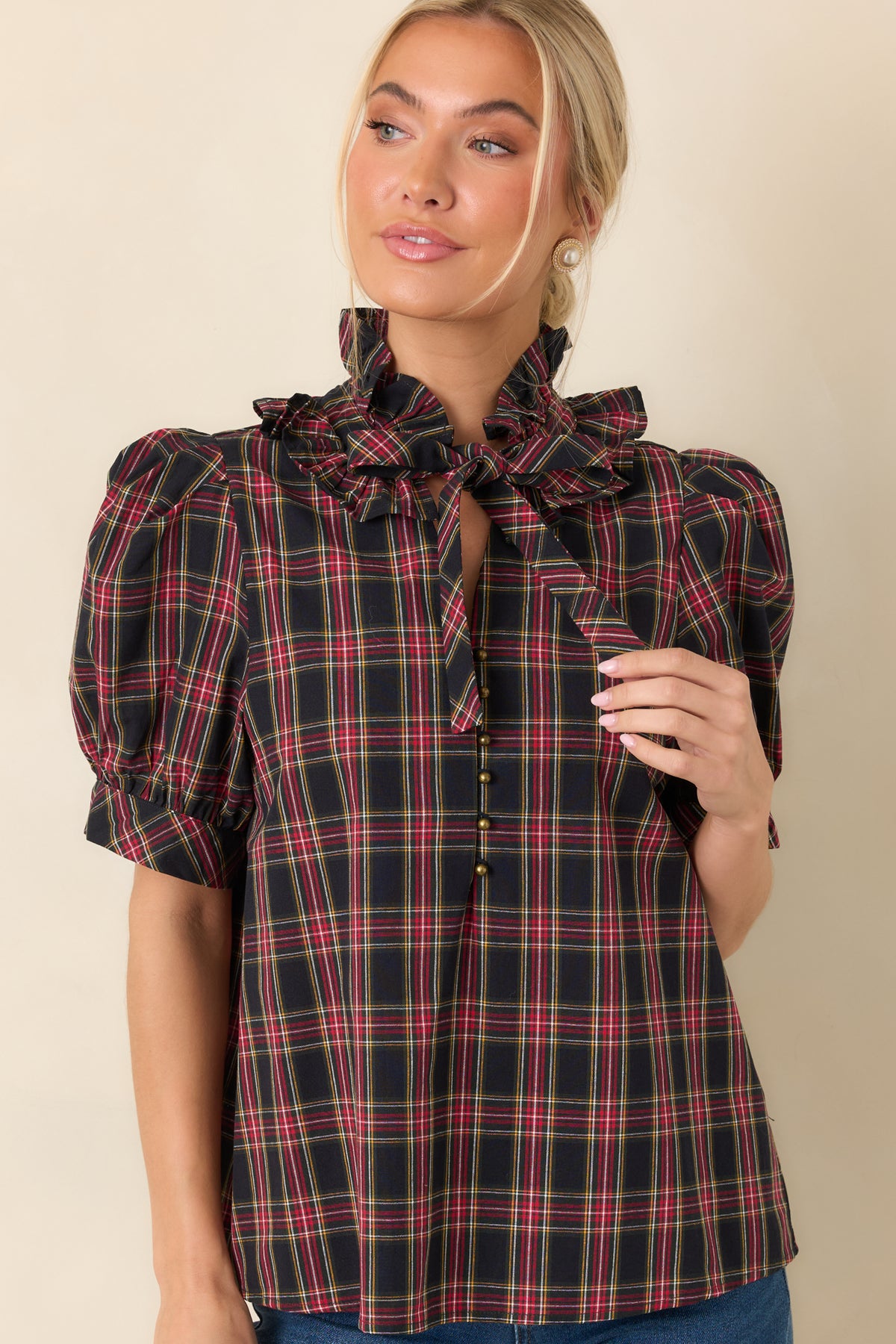 Short plaid puff sleeves finished with fitted bands and softly gathered fabric.