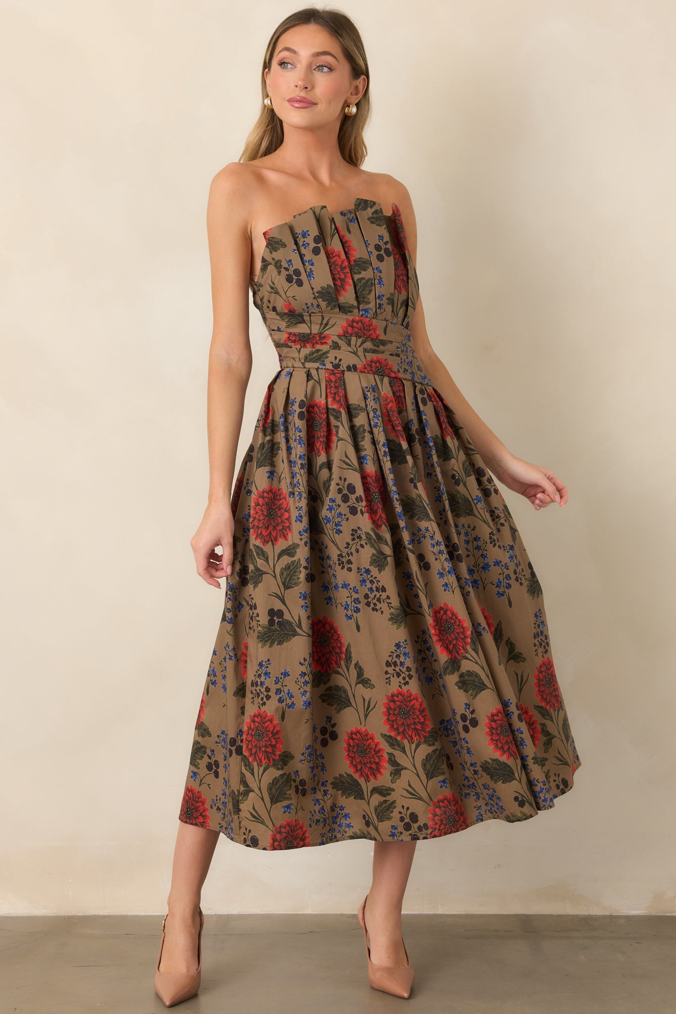 Cotton midi dress featuring a pleated strapless neckline and feminine full skirt covered in a rich multicolor floral pattern.